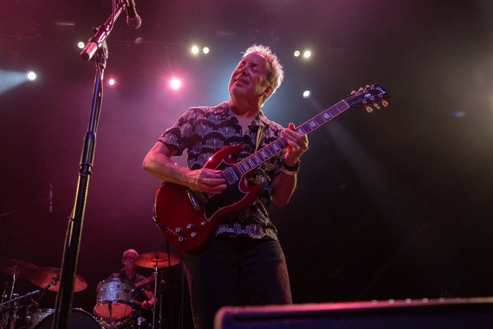  Zuniga plays the guitar and sings during power pop song “Sooner or Later.” 