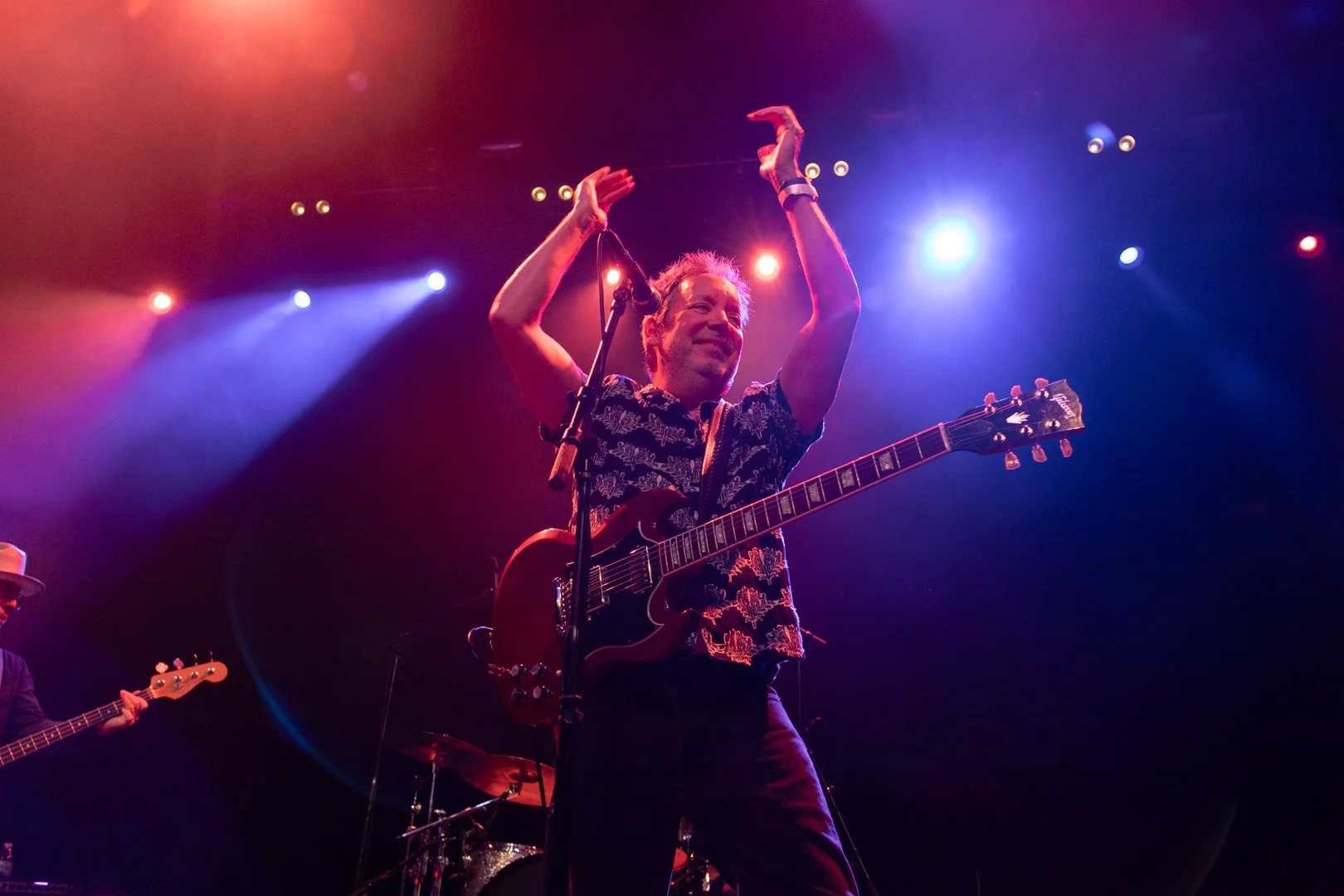  Miles Zuniga, frontman of Fastball, leads the audience in claps before the song “Sooner or Later.” 