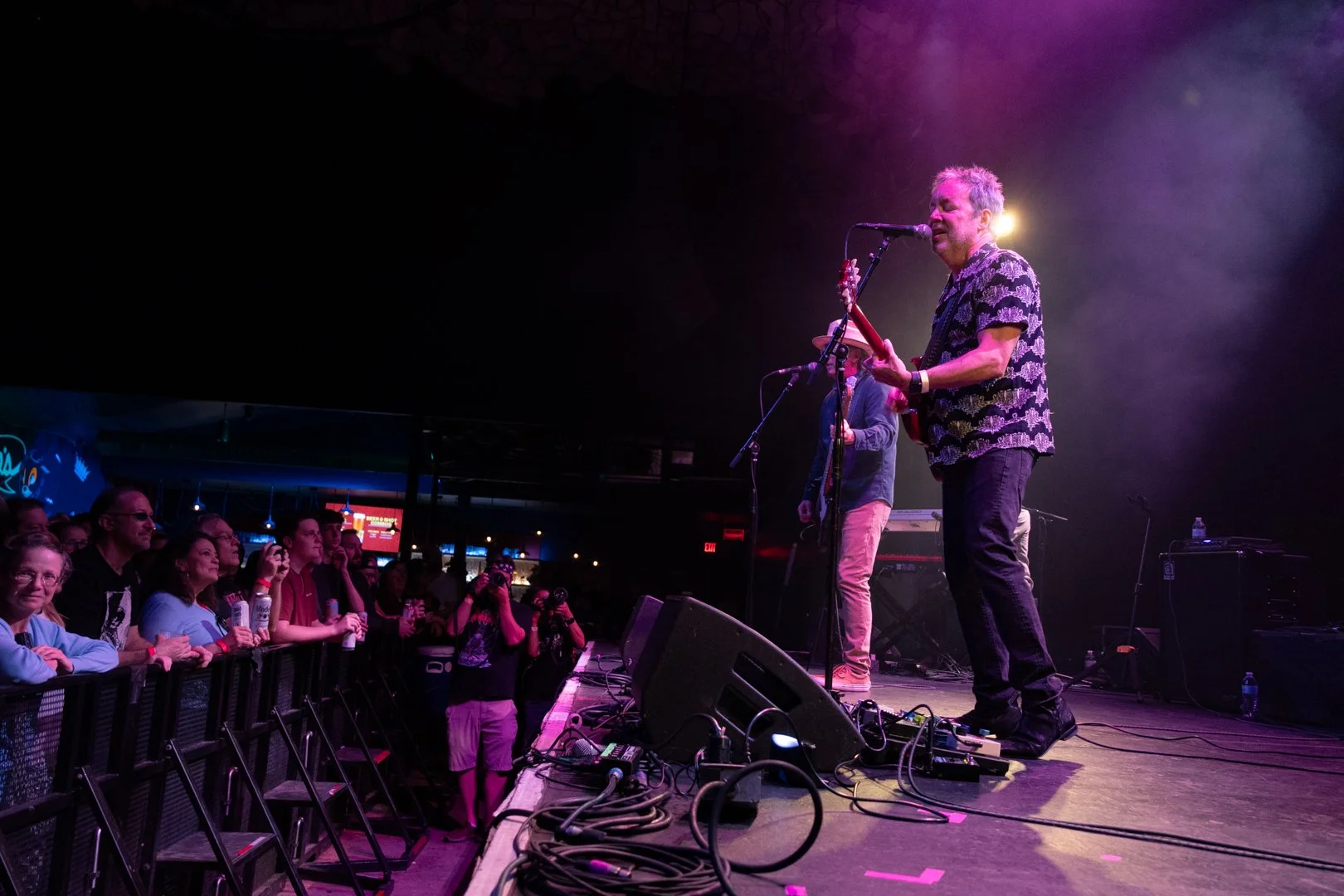  Zuniga and guitarist Tony Scalzo sing “Sooner or Later” off their 1998 album  All the Pain Money Can Buy  to the audience. 