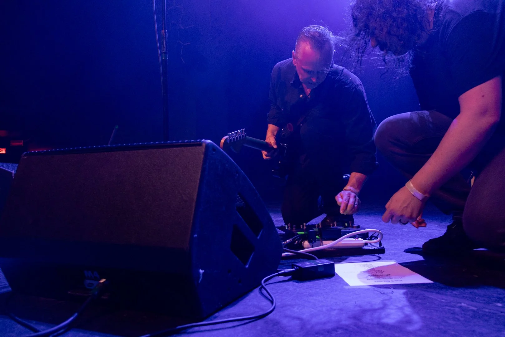  Jon Siebels, guitarist for Eve 6, fixes his guitar sound in between songs. 