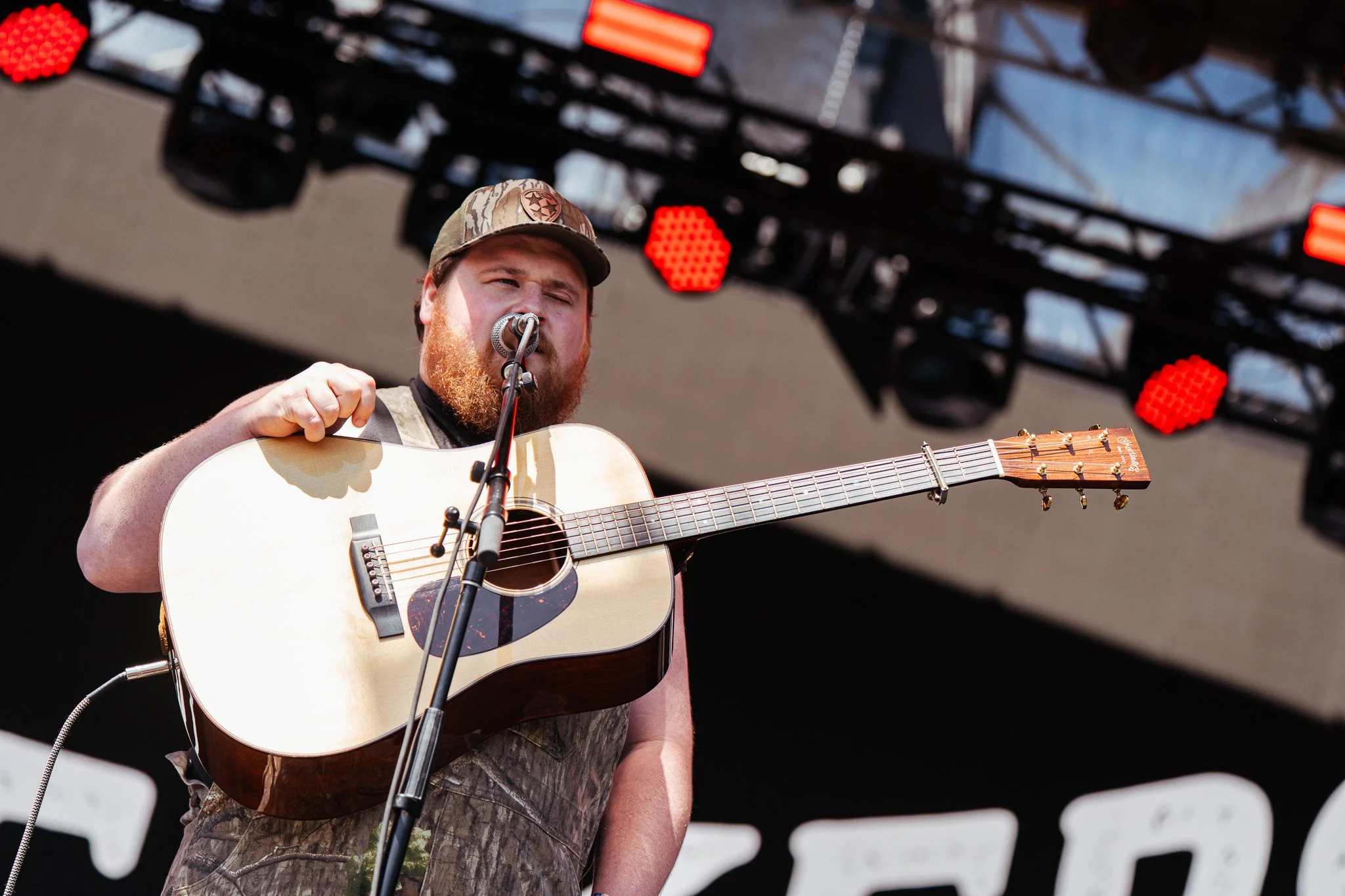  Bluegrass band The Creekers opens the festival at the Pony Up stage with banjo, acoustic guitar, and fiddle instrumentals. 