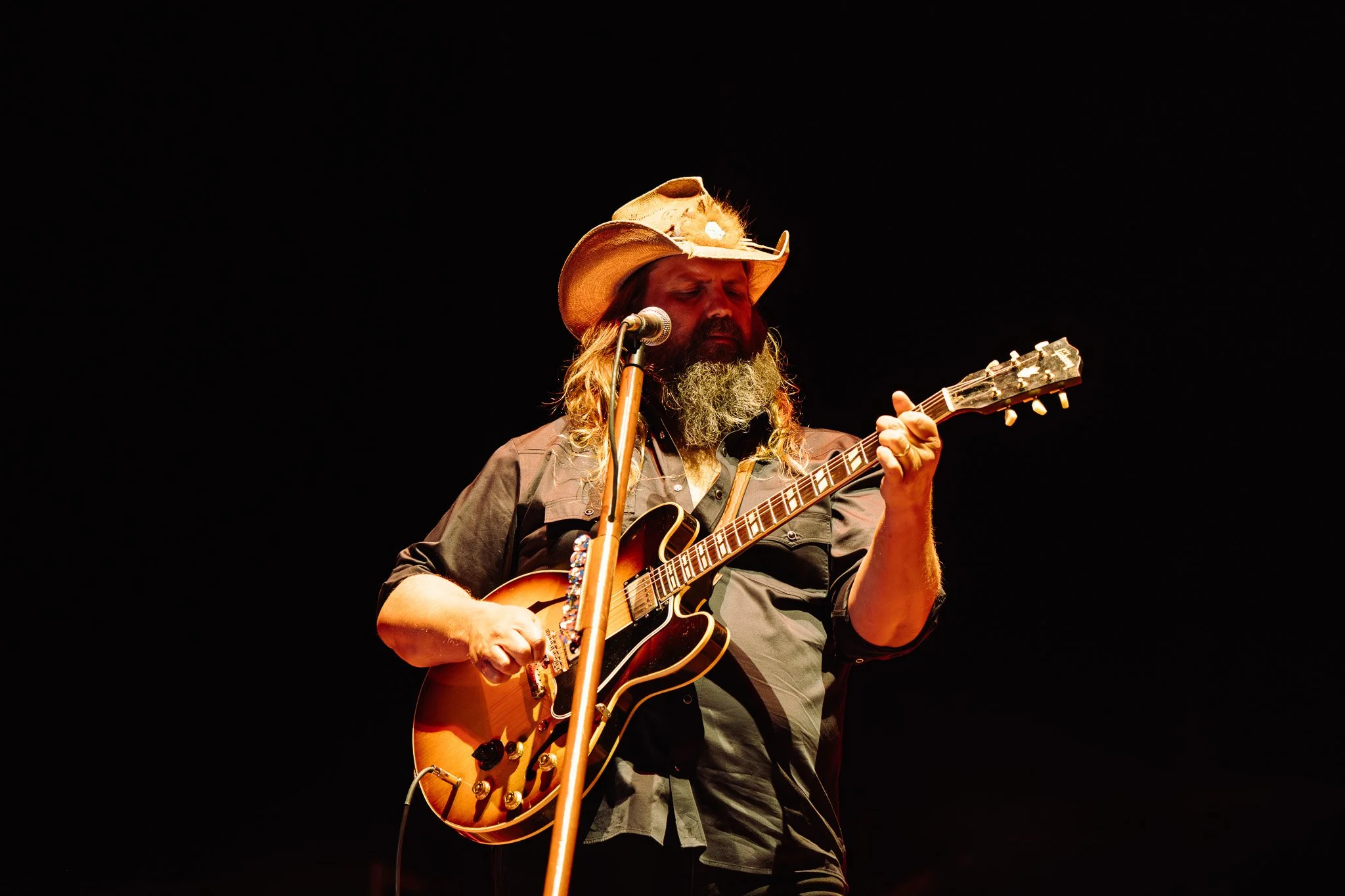  Chris Stapleton headlines the Big River stage and a crowd of thousands. He opens with “Bad As I Used To Be” and mentions his gratitude to fans. 