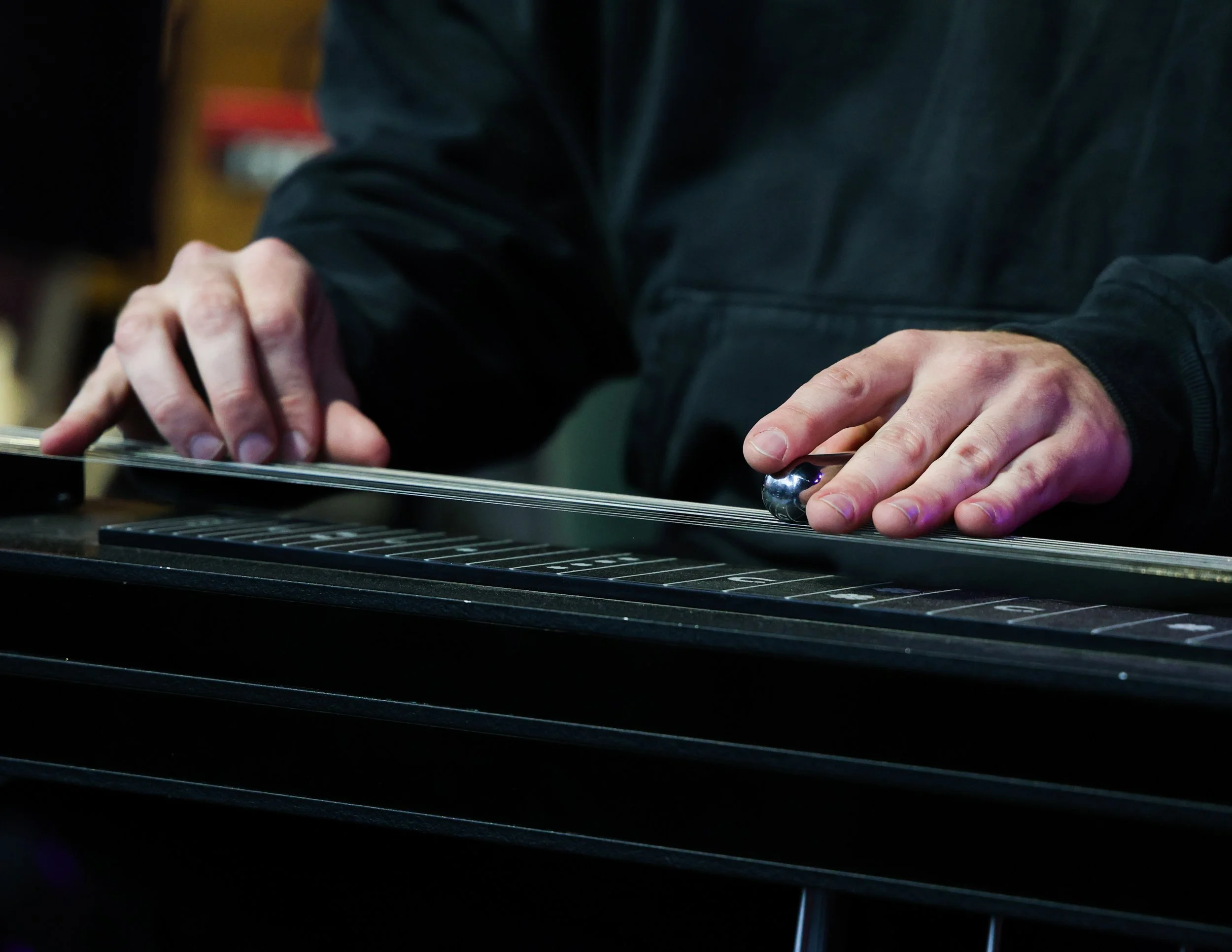  Moran plays the pedal steel guitar to the wistful song “Love and Japan.” 