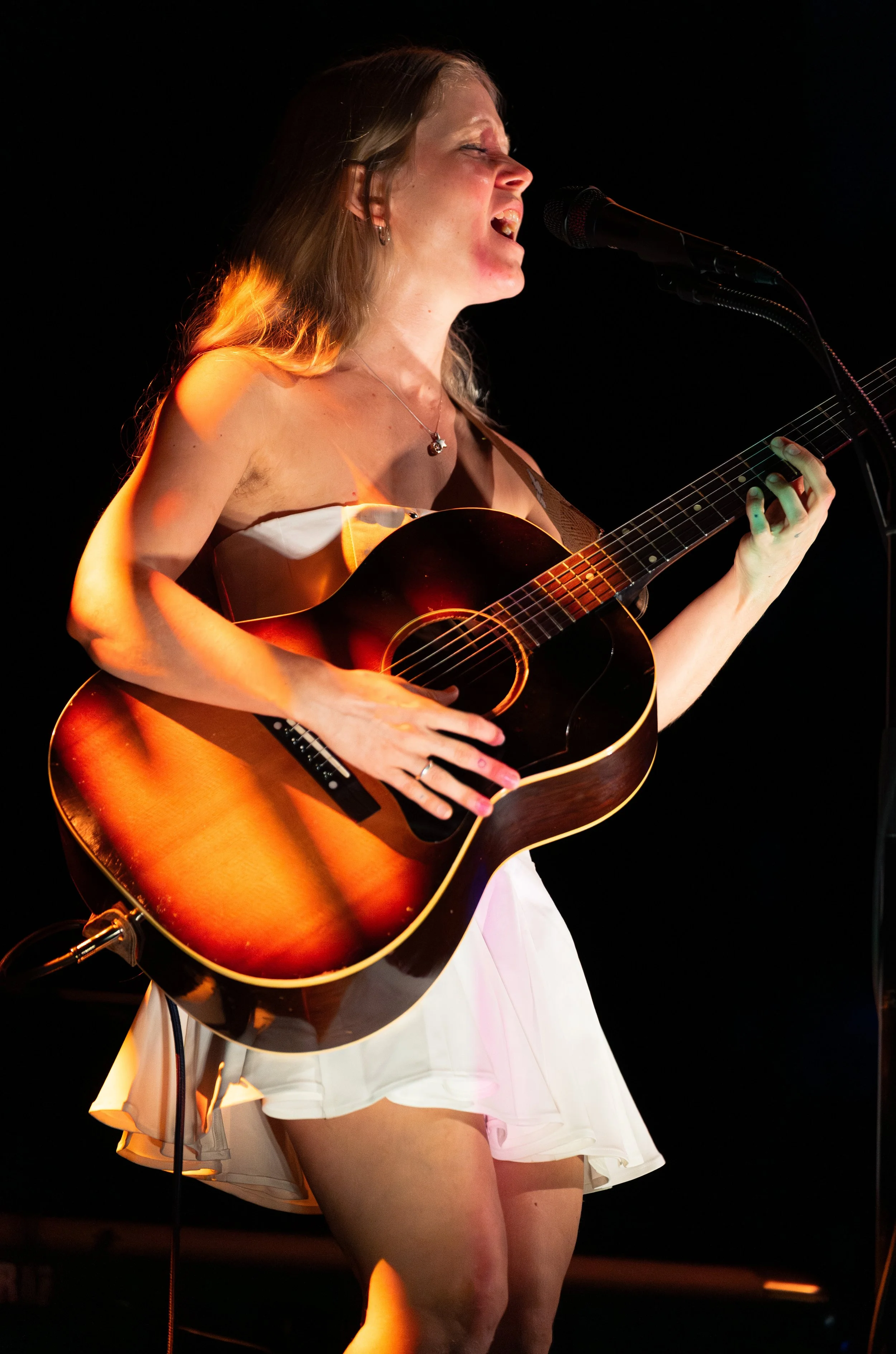  Lou plays the chords of “Darling” while she sings the hopeful lyrics: “I hid you in my heart / Until I couldn’t anymore / But that’s just how it works / When love is on your side.” 