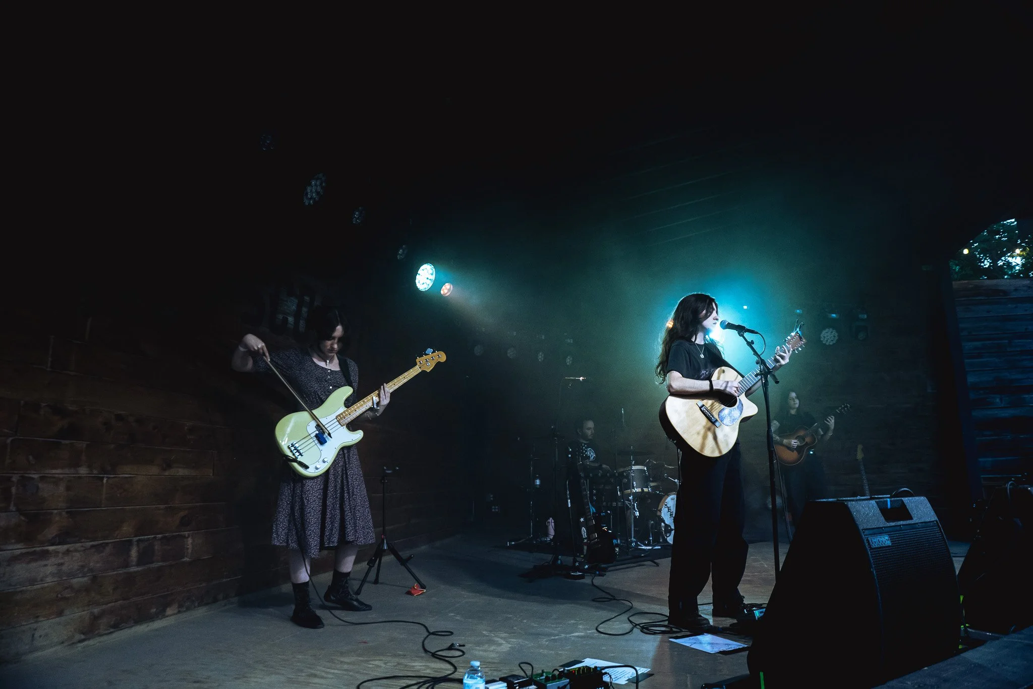 Alec Duckart, also known as Searows, takes the stage with his band under a blue light. 