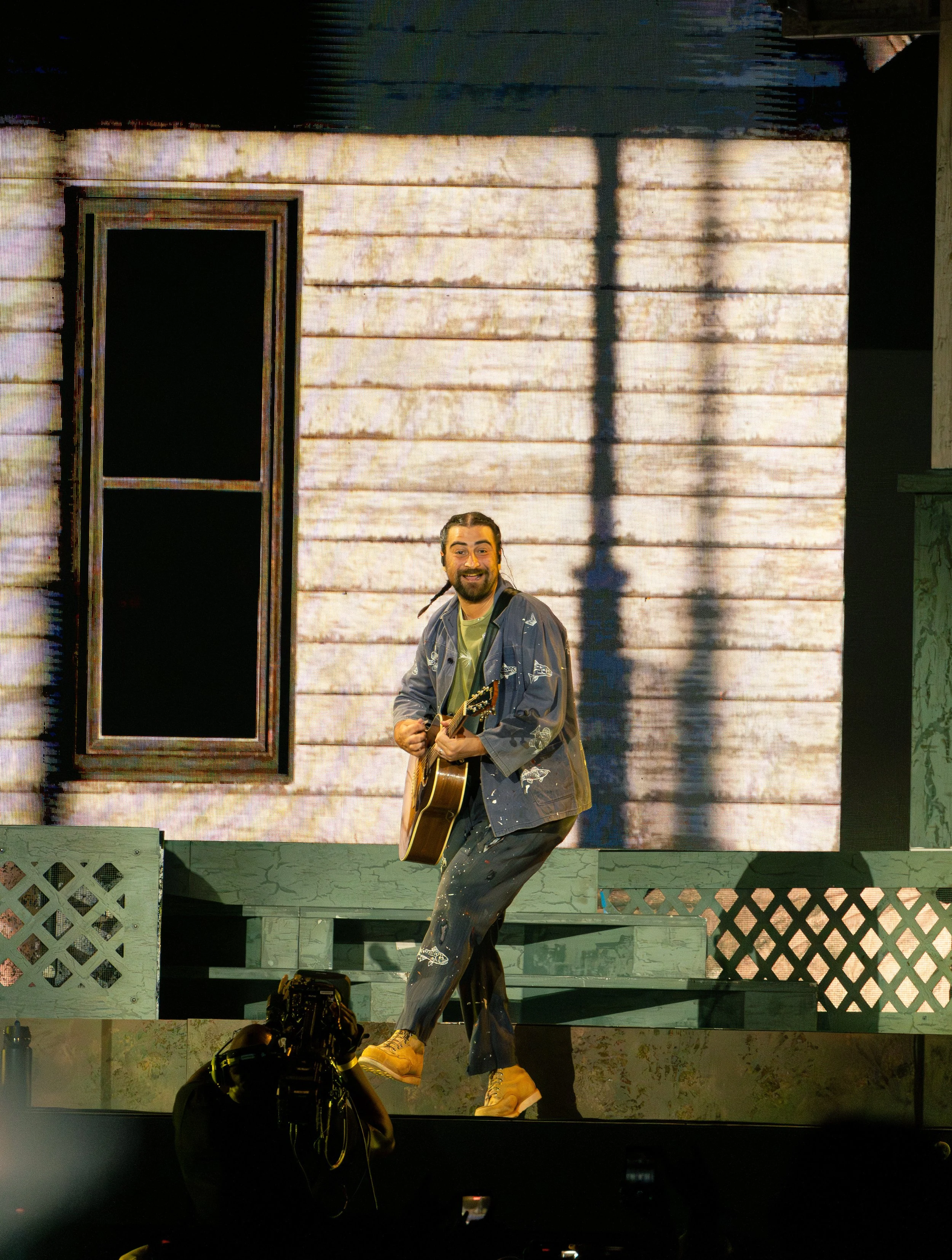  Kahan plays guitar as he runs onto the stage to perform “American Cars” from his latest album  The Great Divide: The Last Of The Bugs.  