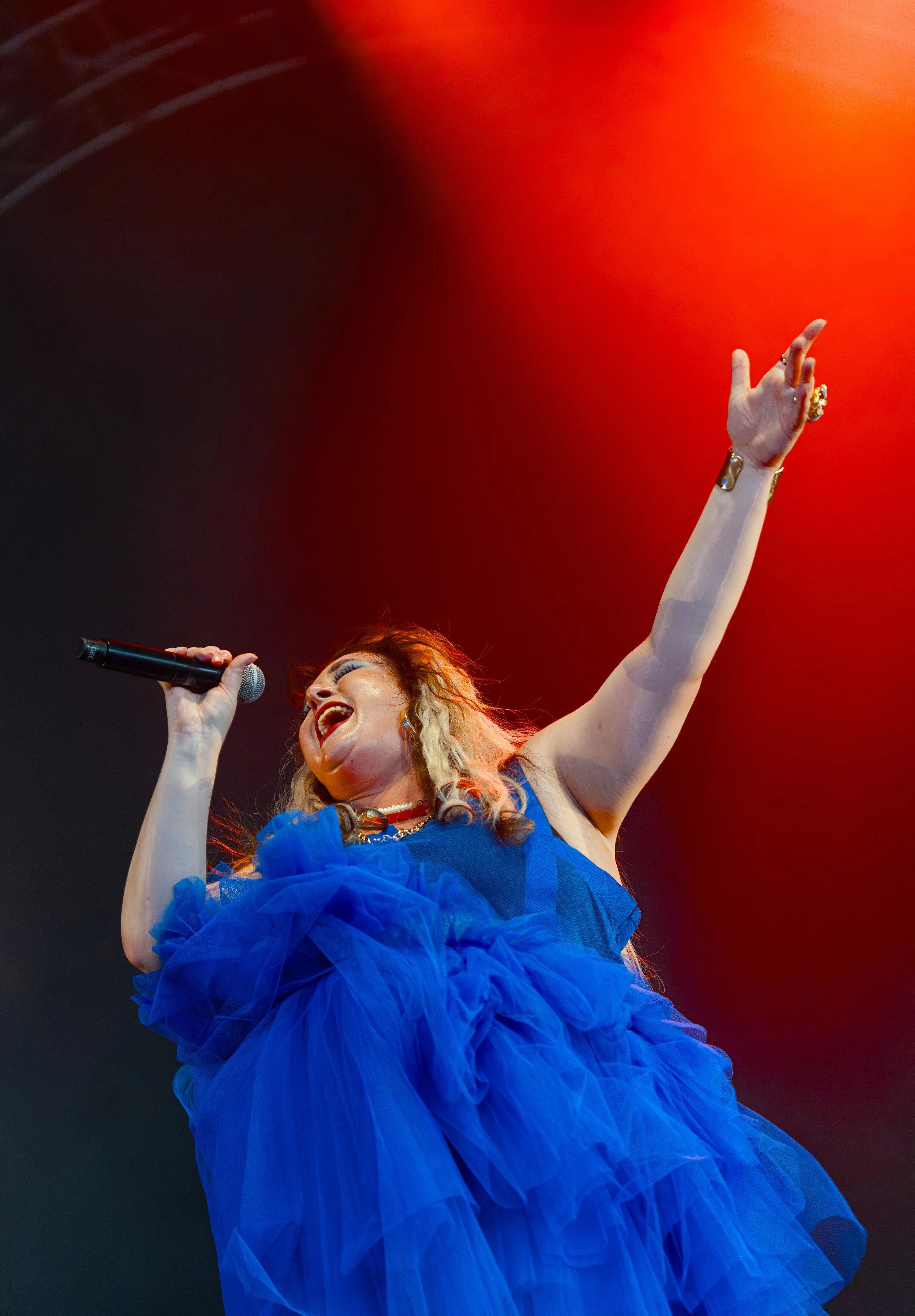  MEEK reaches towards the sky as she sings the up-beat lyrics of “Brixton”: “Oh man, they’re sick of me / You can take the Brit out of Brixton / But you can’t stop this girl chugging on six nines.” 