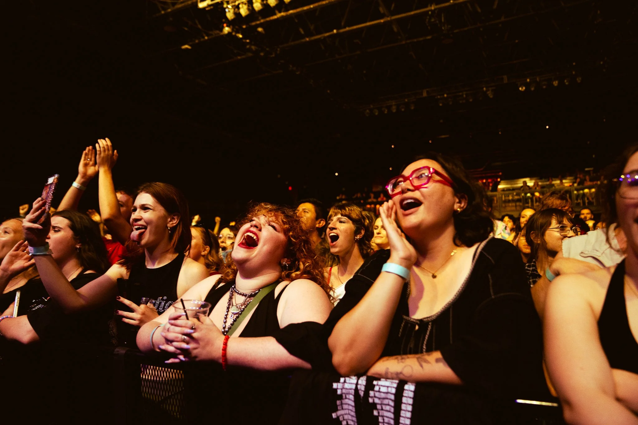  Fans cheer on Hemlocke Springs as she performs “sense (is),” her intricate song from  the apple tree under the sea.  