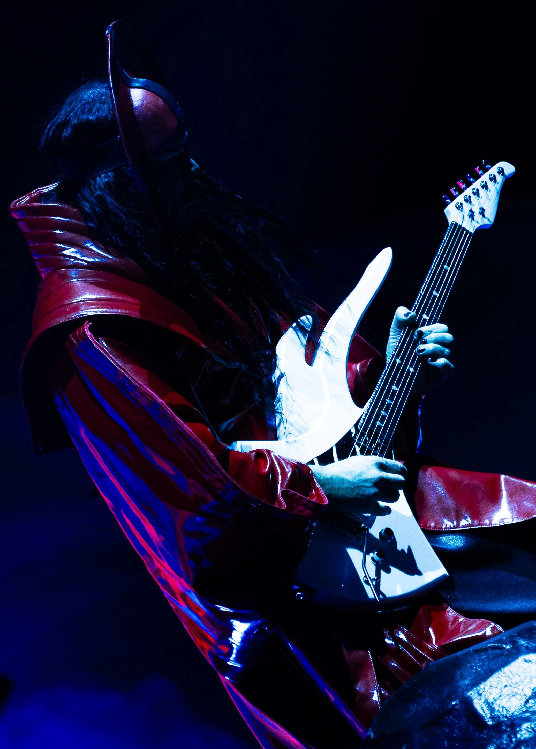  Empire of the Sun frontman Luke Steele rocks out on the guitar during “Changes” from the band’s latest album  Ask That God.  