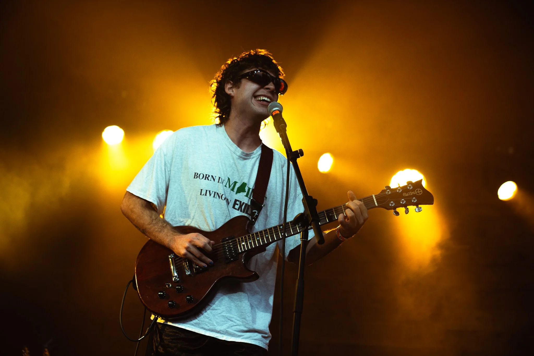  Bright yellow lights glow as hey, nothing starts its set with an acoustic version of “Hound.” 