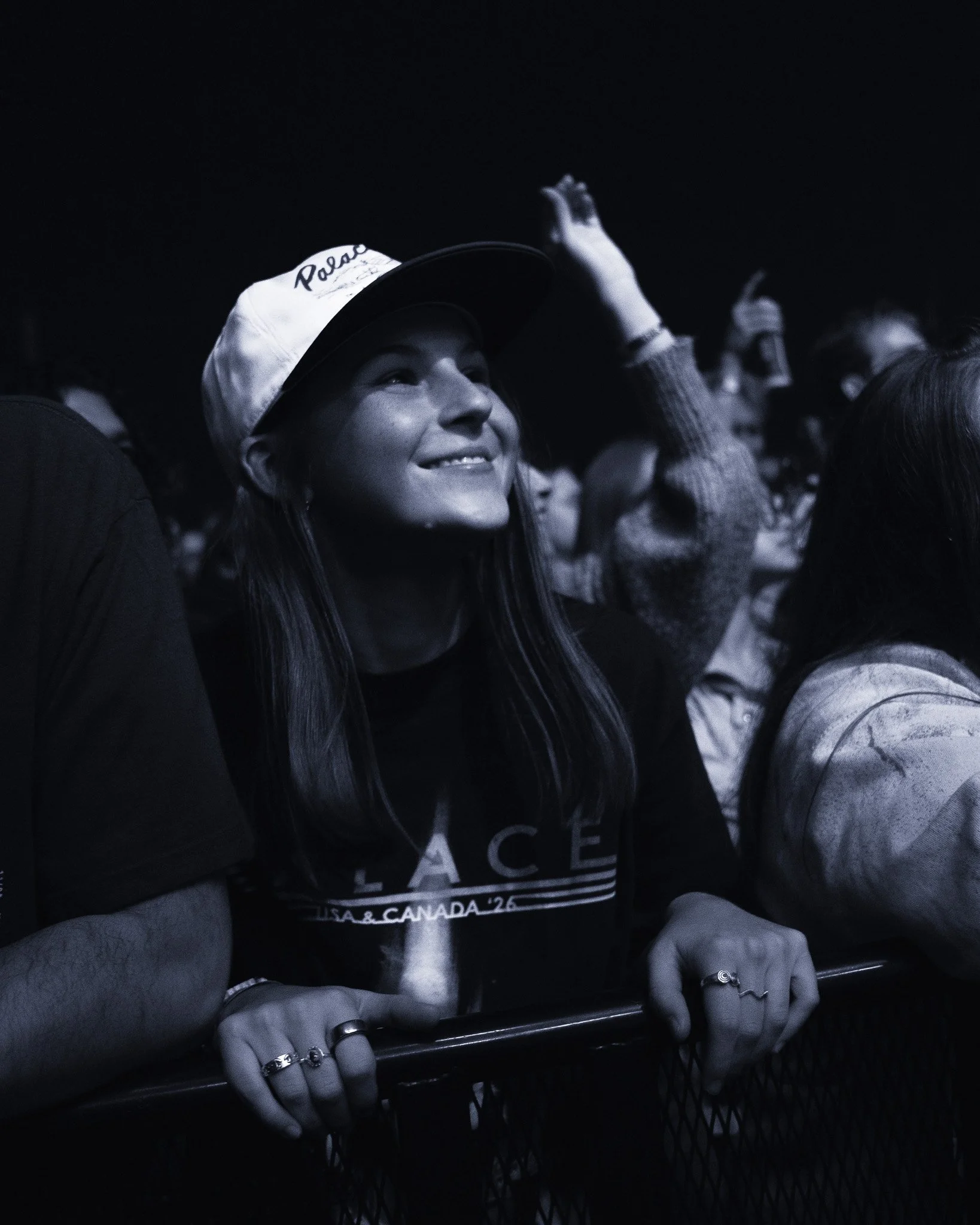  Fans on the barricade scream out the lyrics to “Bitter”: “Why am I bitter, bitter, bitter? / Why am I always led astray? / It’s gonna get better, better, better / I’ve always heard you say.” 