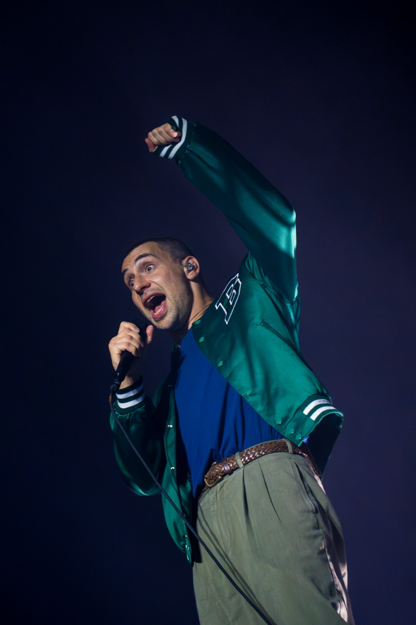  Lead singer of Bleachers Jack Antonoff throws his arm in the air while singing "Sideways," the opening song from the band’s 2026 album  Everyone for Ten Minutes . 