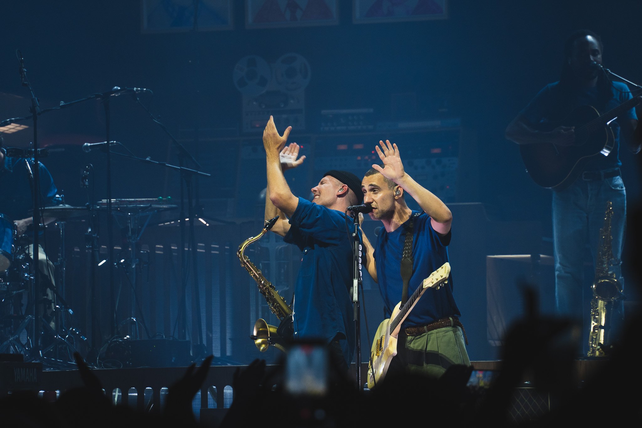  Antonoff holds his hand up while Evan Smith claps during the performance of "Jesus Is Dead." 