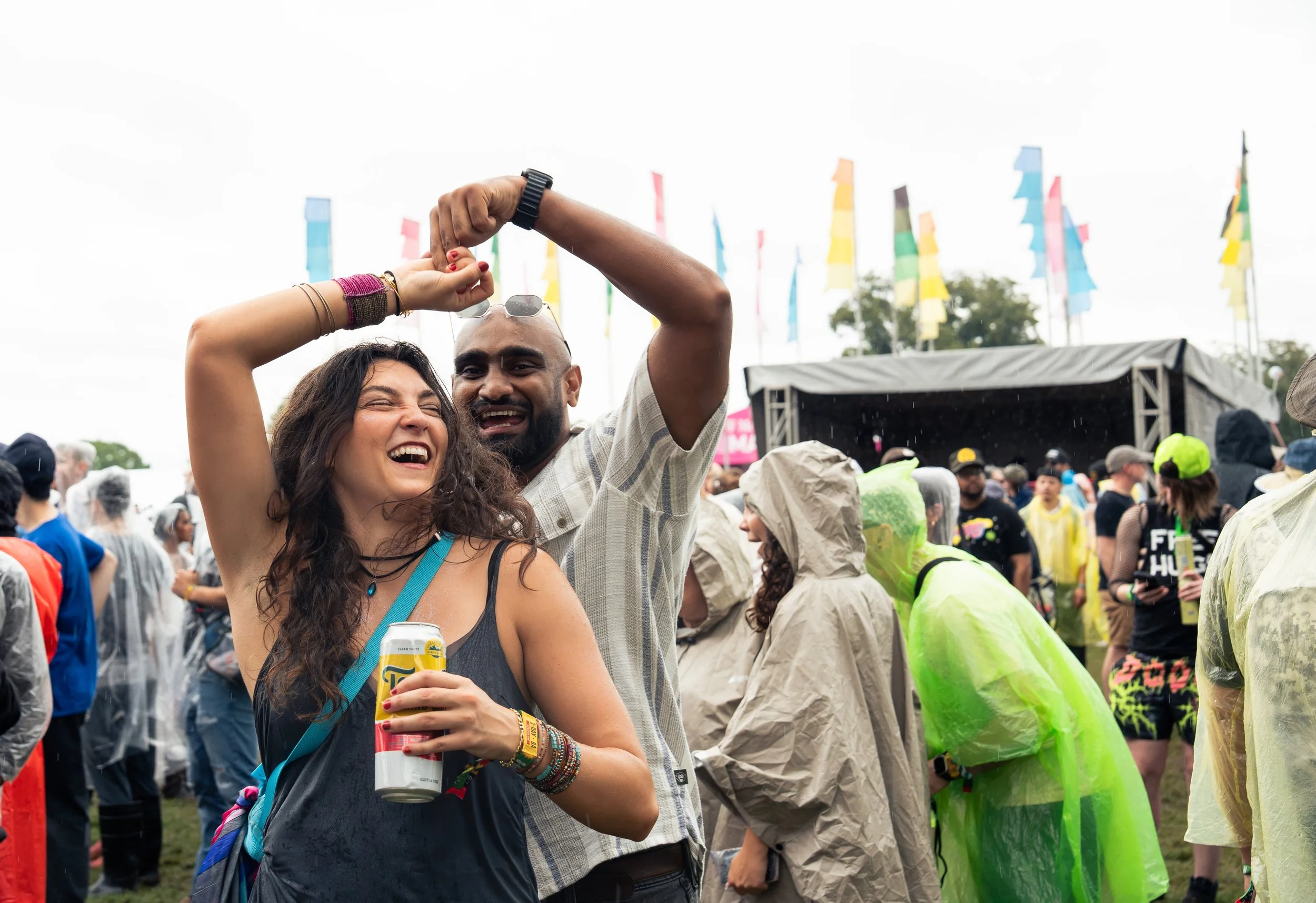  A couple dances in the rain as they wait for Grocery Bag’s set to begin. 