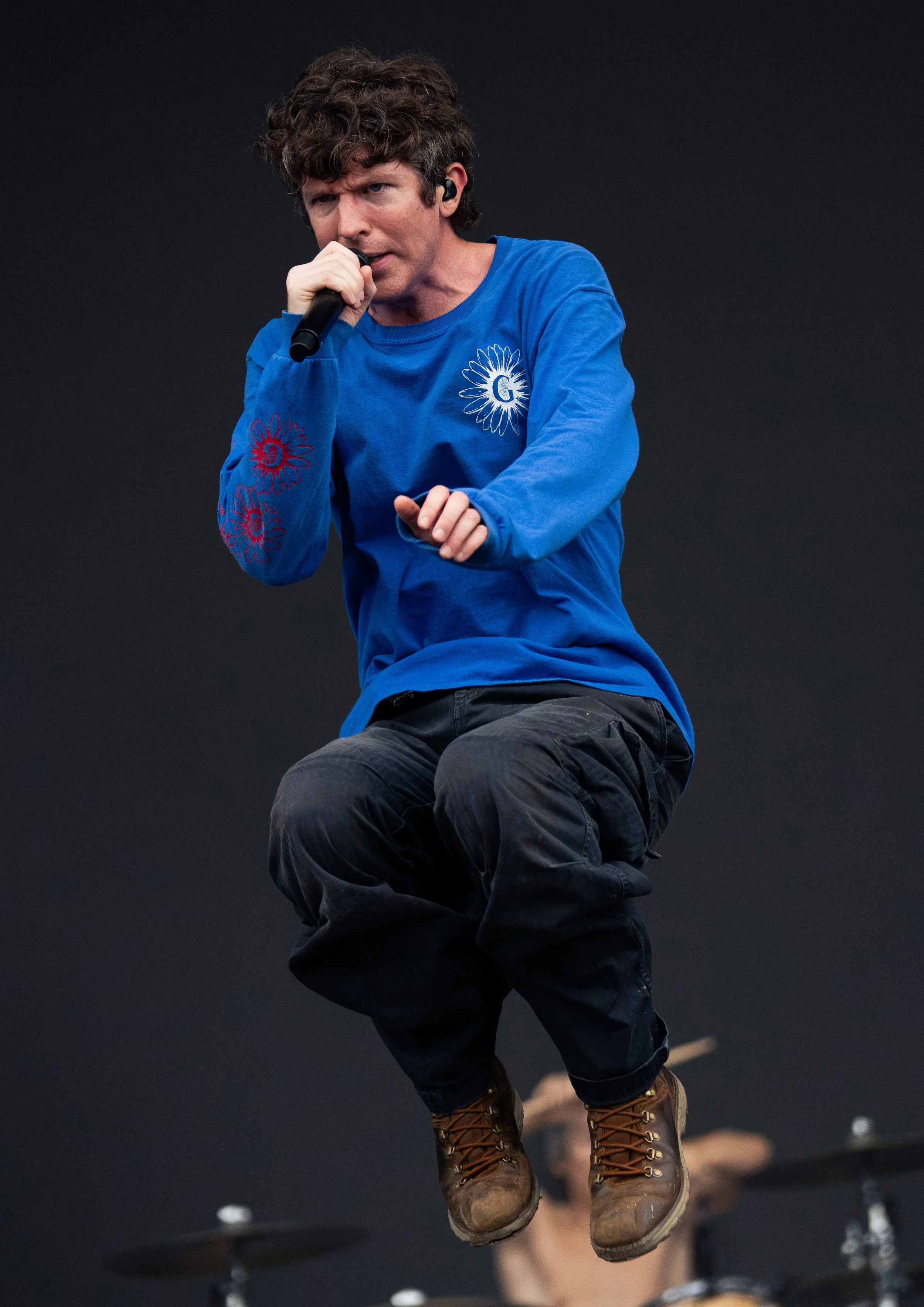  Turnstile’s lead vocalist Brendan Yates jumps around as he performs “BIRDS” from the band’s 2025 album  NEVER ENOUGH.  