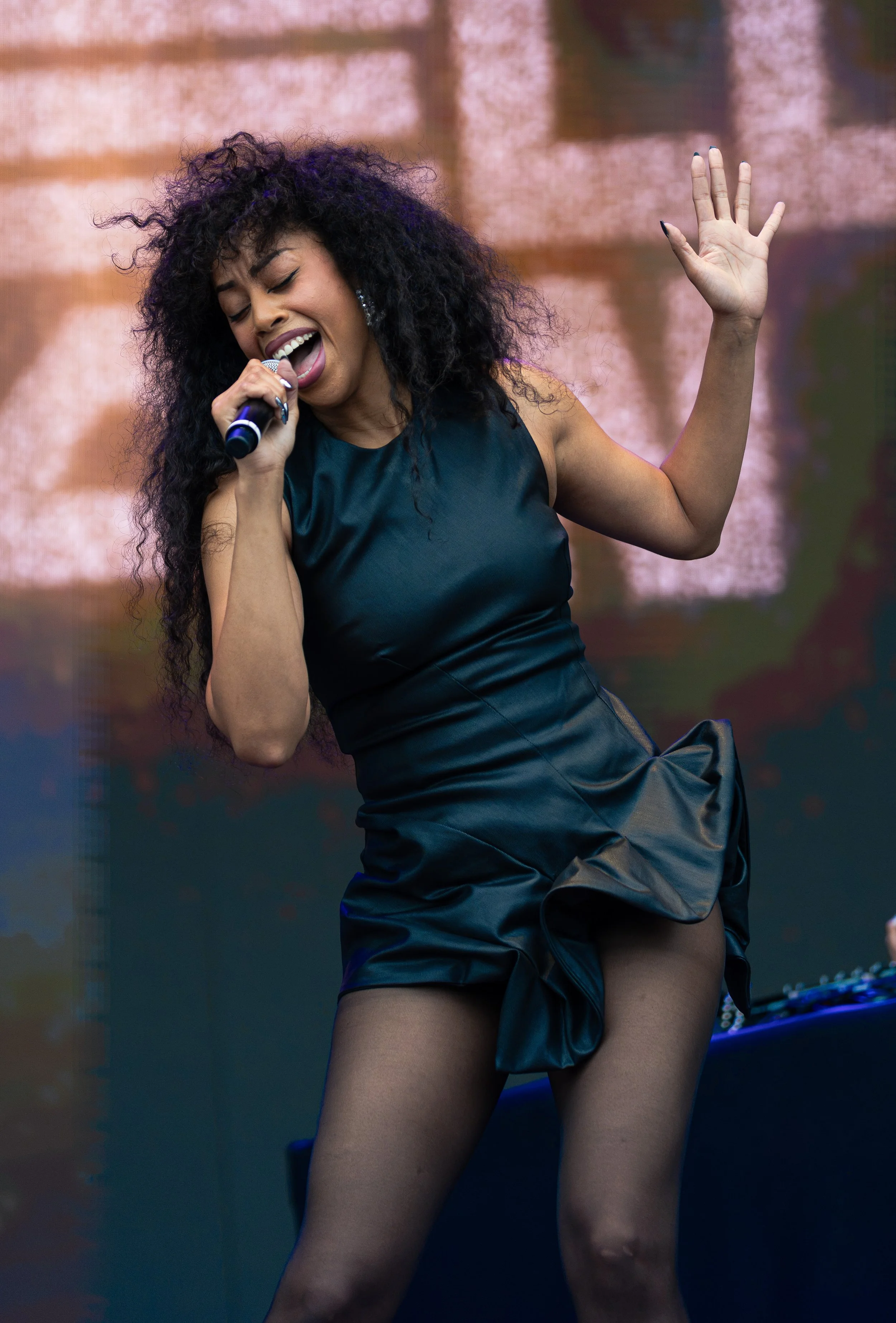  Jordan dances around as she sings the upbeat lyrics of “Close 2 Me”: “It's not fair what you do to me / Make me wanna live in a fantasy / Where we drop everything and leave / Can we just go tonight.” 