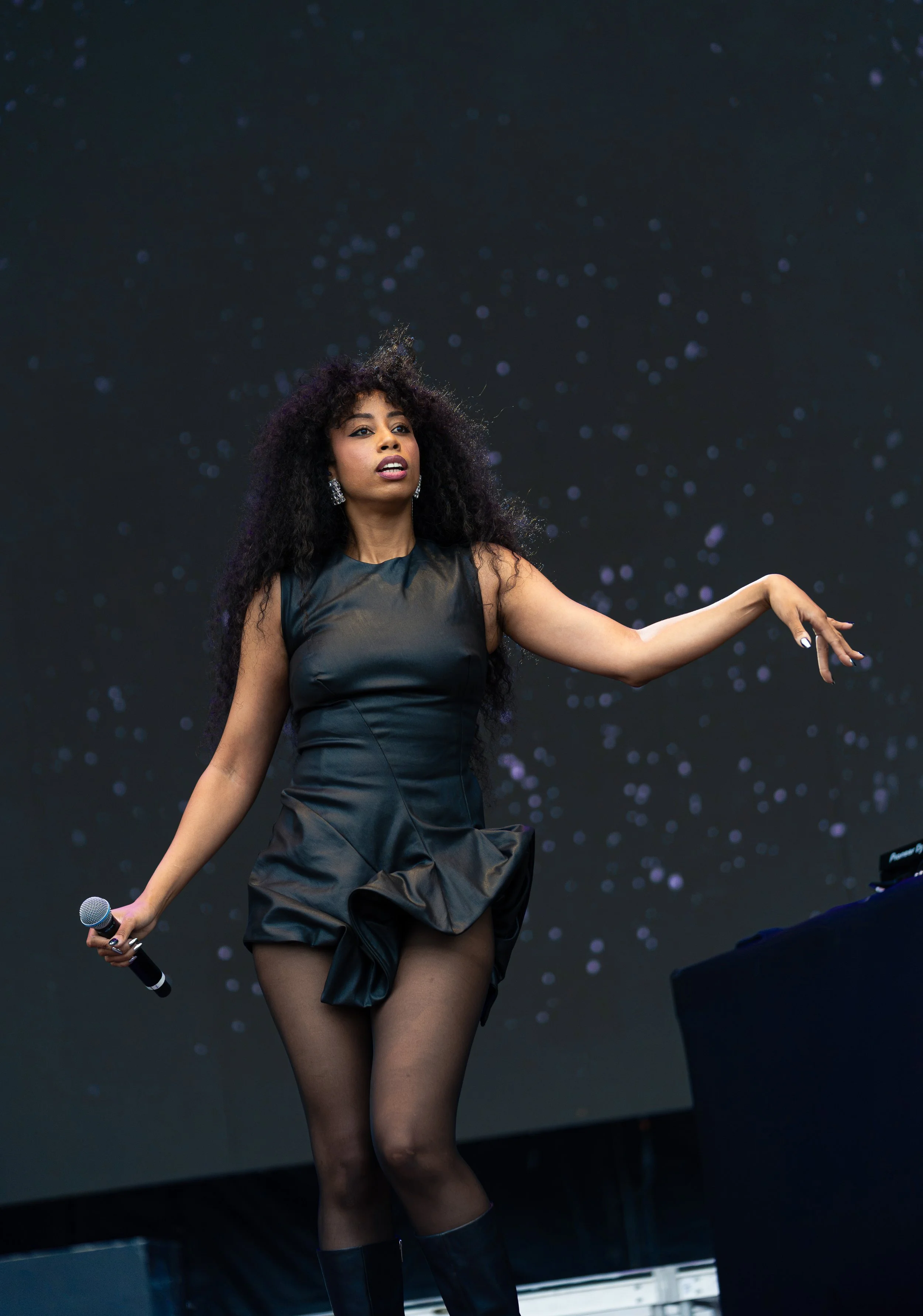  Jordan dances around as she sings the upbeat lyrics of “Close 2 Me”: “It's not fair what you do to me / Make me wanna live in a fantasy / Where we drop everything and leave / Can we just go tonight.” 