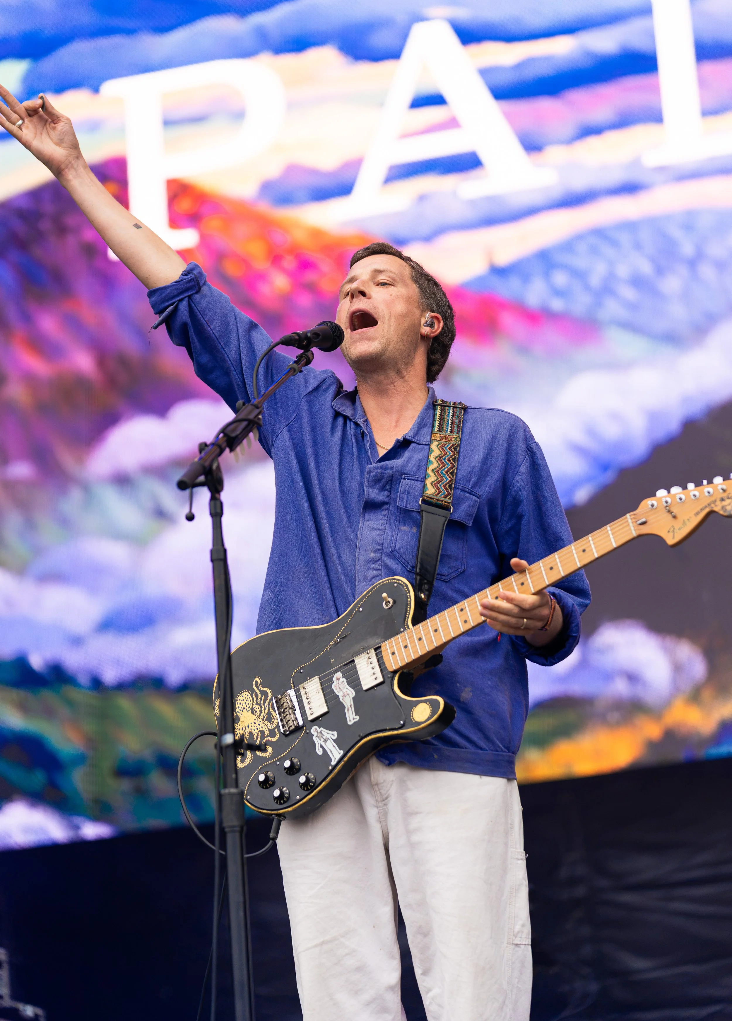  Leo Wyndham, lead singer of indie rock band Palace, holds up his hand as the band starts its set with “Bitter.” 