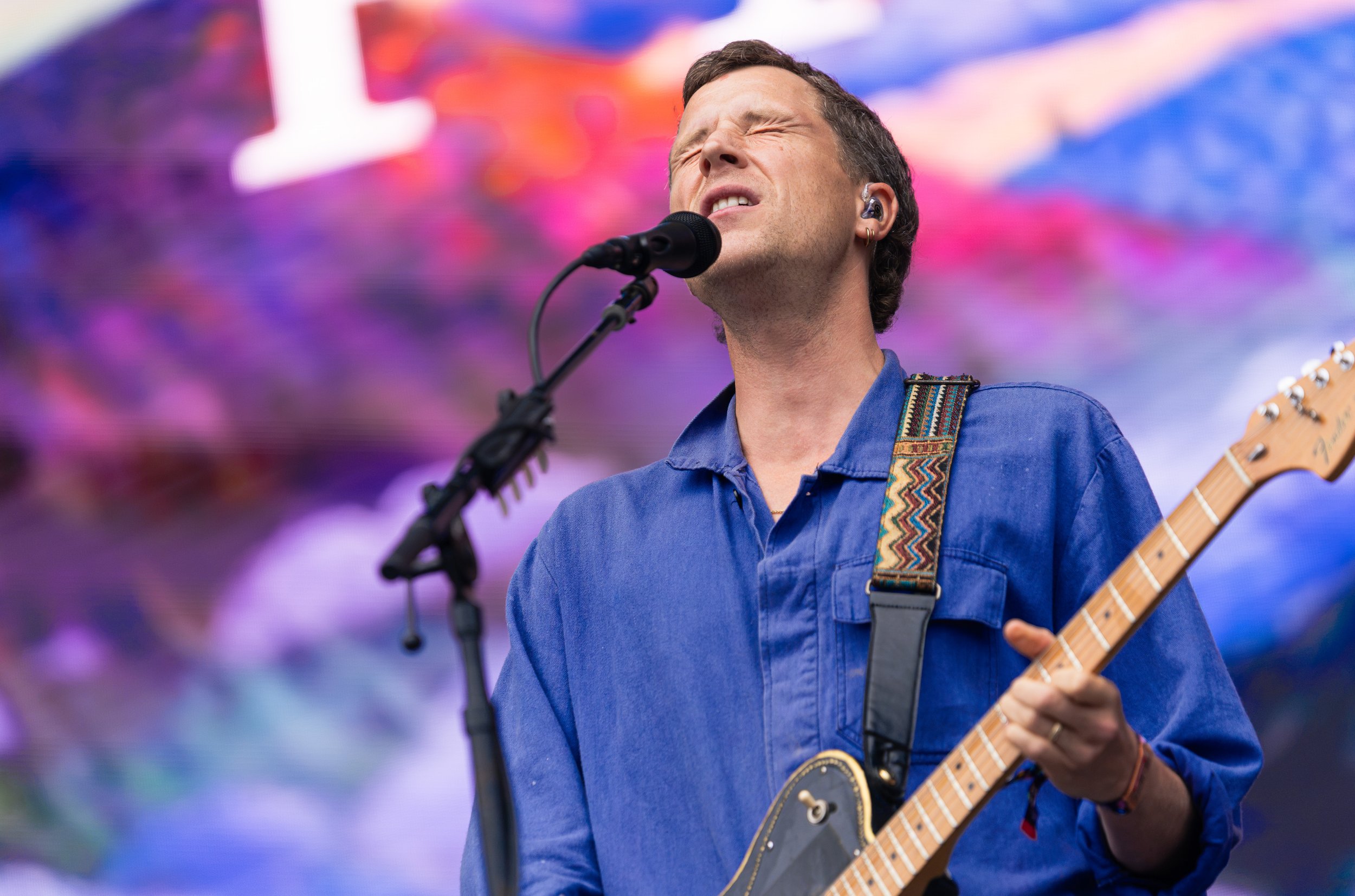  Wyndham sings the nostalgic lyrics of “Kid”: “I count the days 'till I will see you / 'Cause I'm miles away and kid, I love you / We'll drive away with your hair out the sunroof.” 