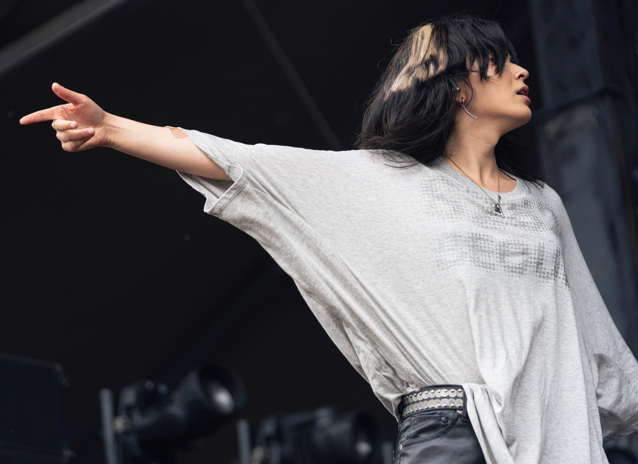  Hyperpop artist underscores points toward the crowd as she begins her set with “Point A.” 