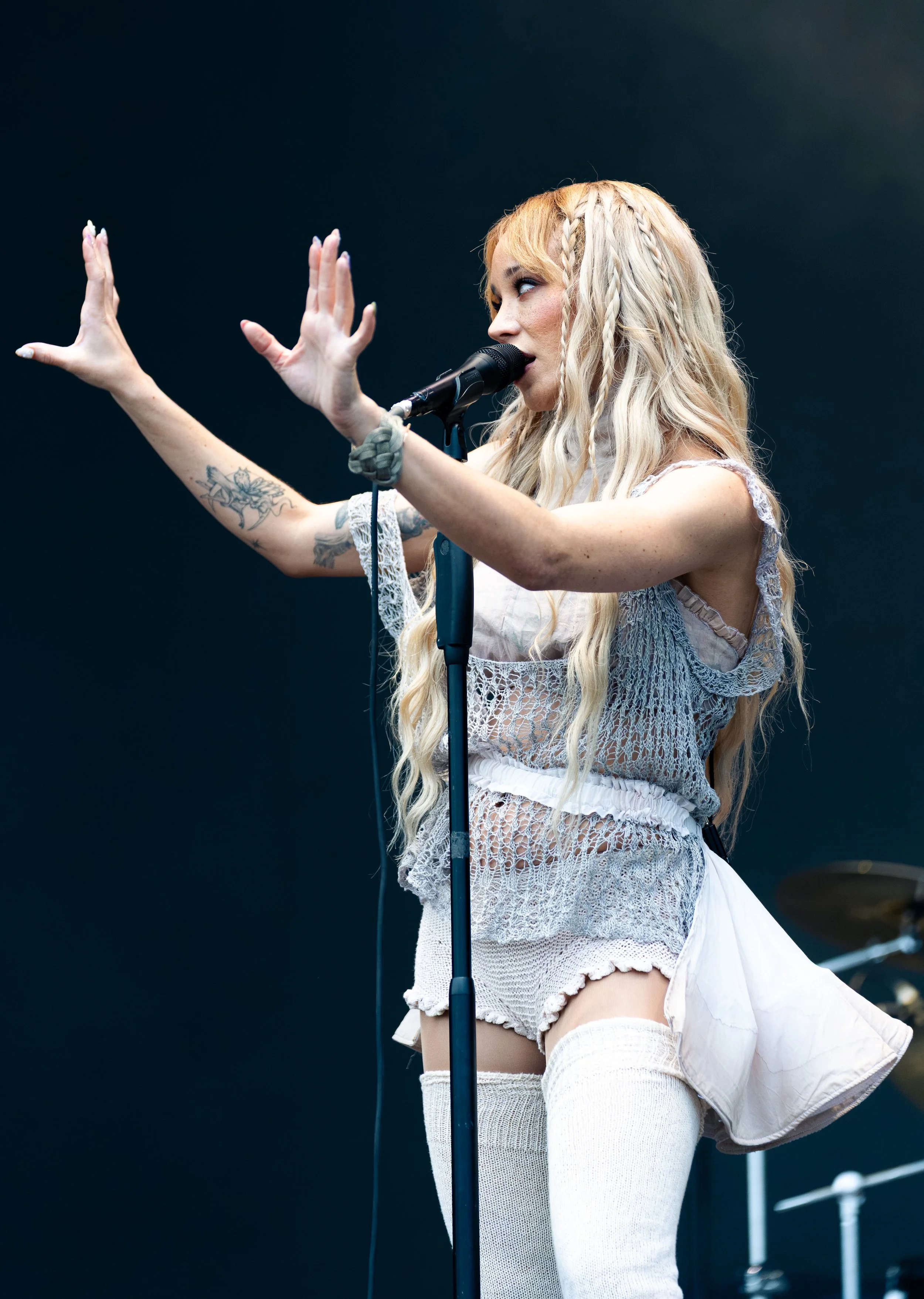  Frontwoman of indie-pop band Cannons Michelle Joy holds up her hands as she sings “Loving You.” 