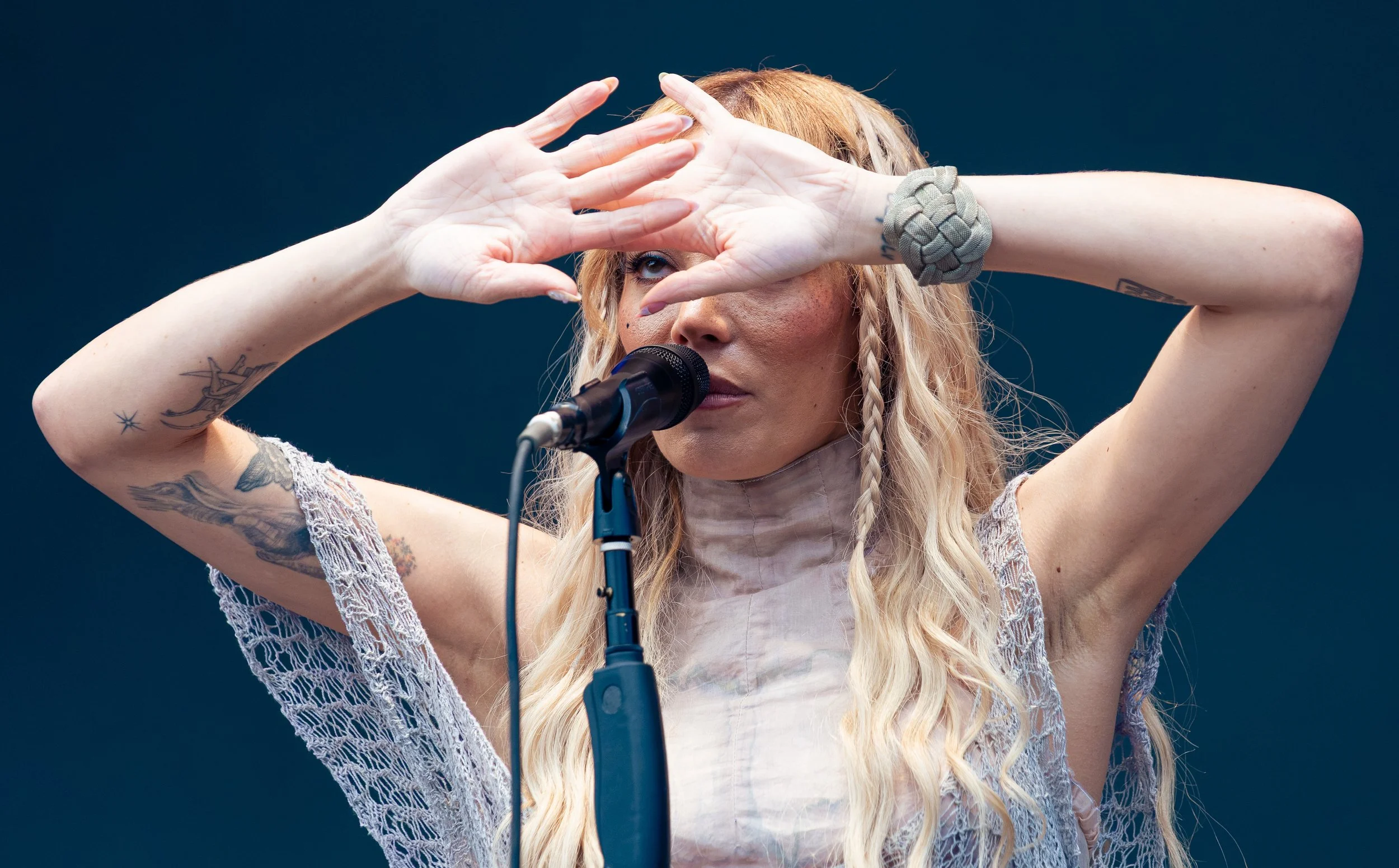  Frontwoman of indie-pop band Cannons Michelle Joy holds up her hands as she sings “Loving You.” 