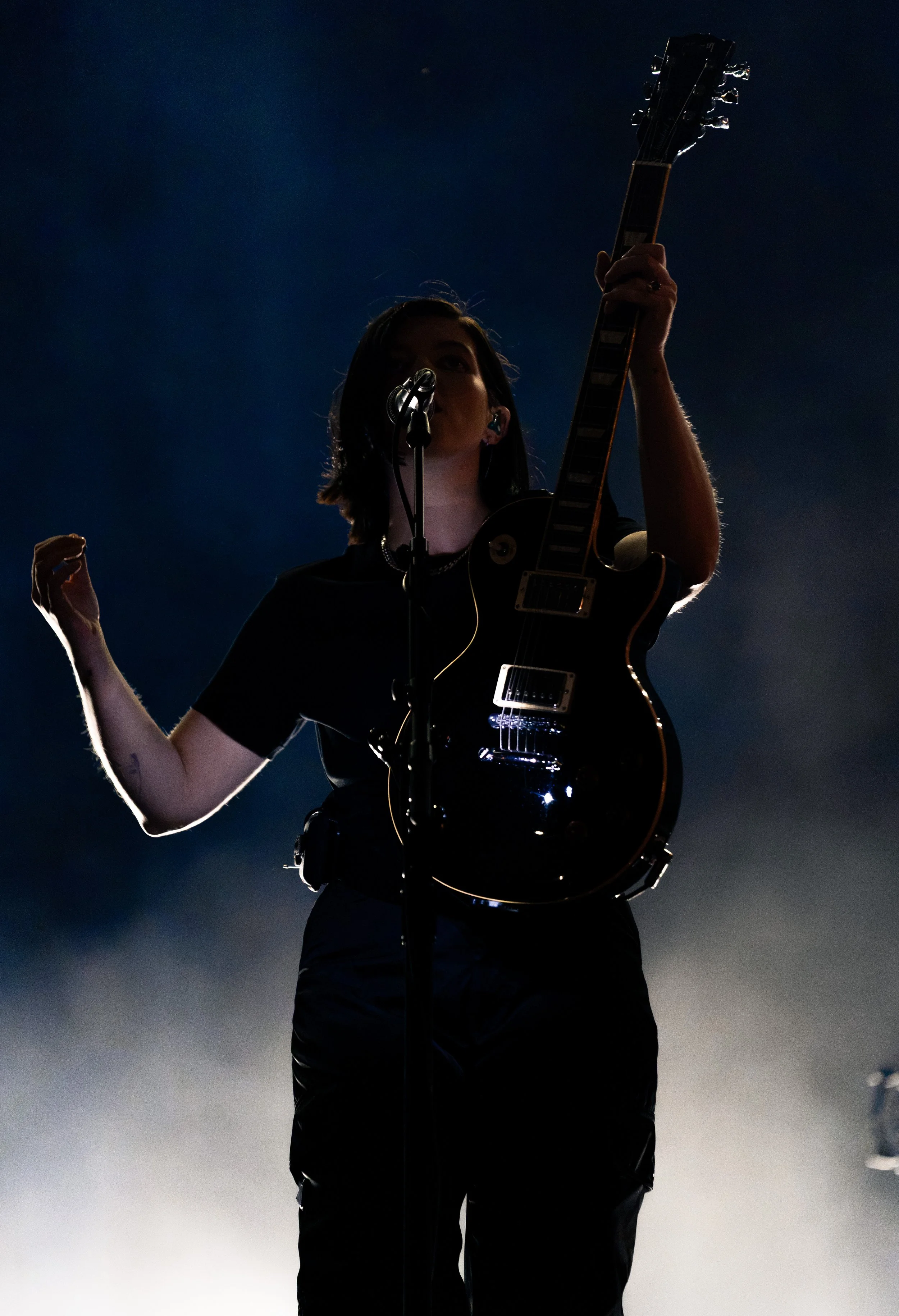  Croft holds up her guitar as she finishes singing “Islands”: “I am yours now (I am yours now) / So now I don't ever have to leave (ever have to leave) / I've been found now (been found now) / So now I'll never explore.” 