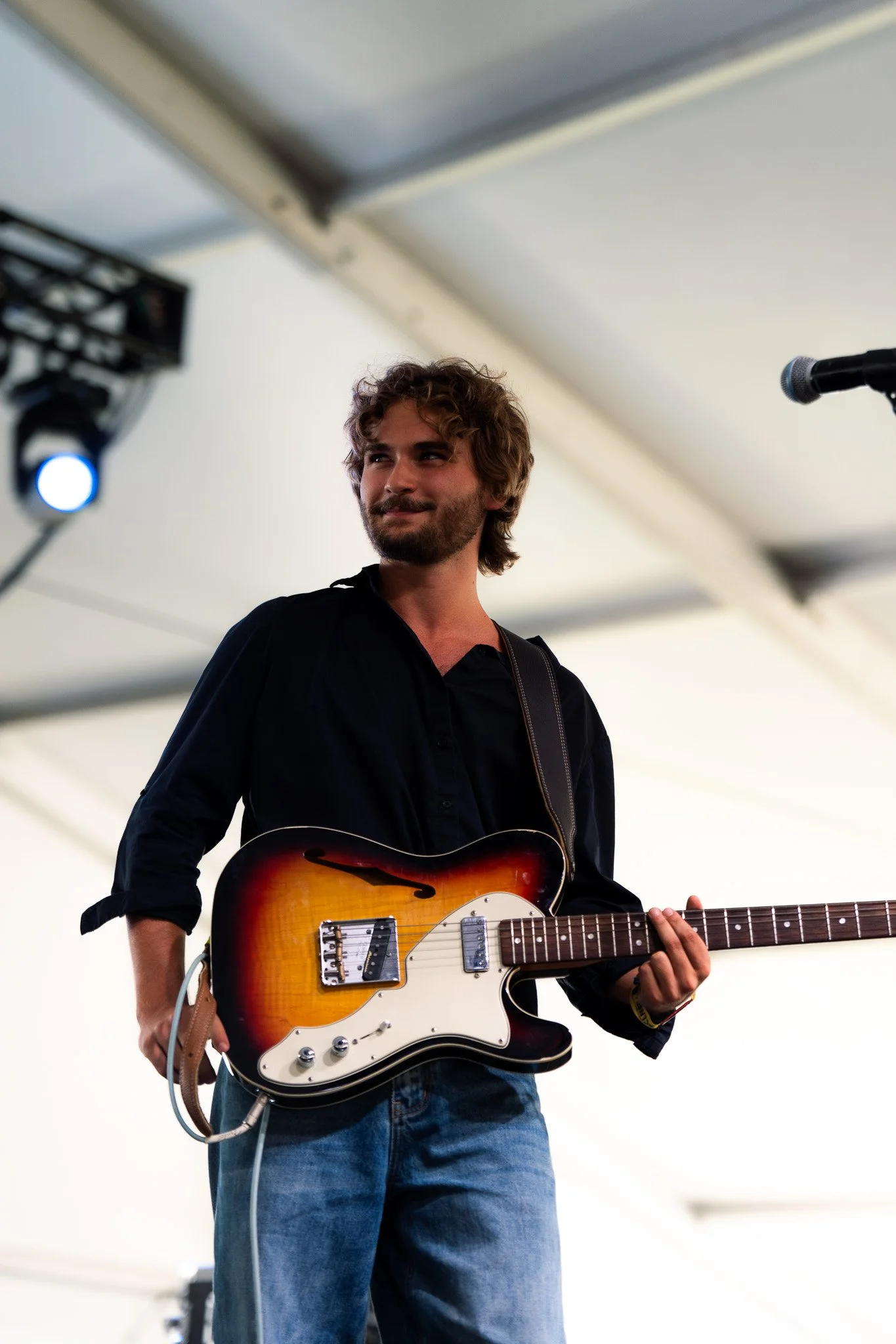  Austin native Bo Staloch grins as he performs “Springtime Red Tulips” and “Your Eyes Tell Stories” on the Tito’s Stage. 