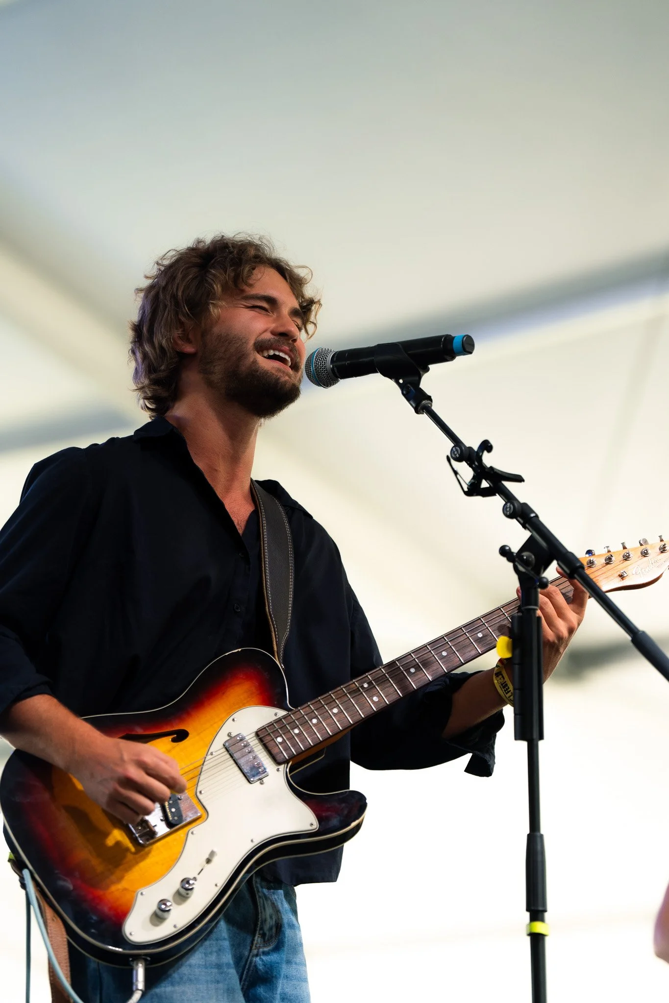  Austin native Bo Staloch grins as he performs “Springtime Red Tulips” and “Your Eyes Tell Stories” on the Tito’s Stage. 