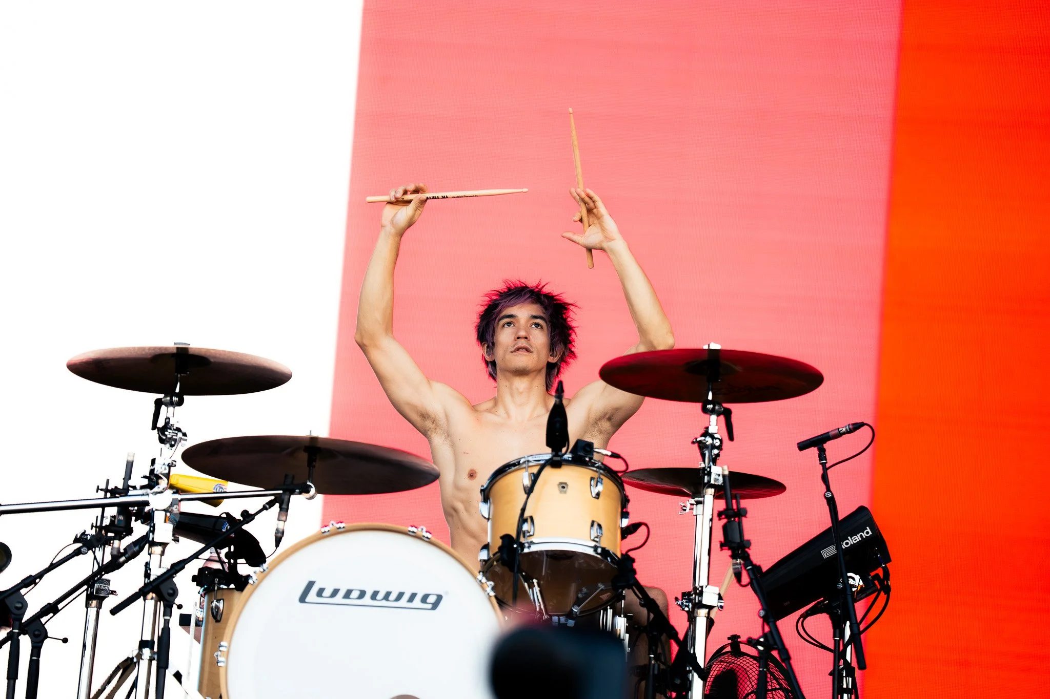  Turnstile drummer Daniel Fang holds his drum sticks up in the air before starting the beat for “BIRDS.” 