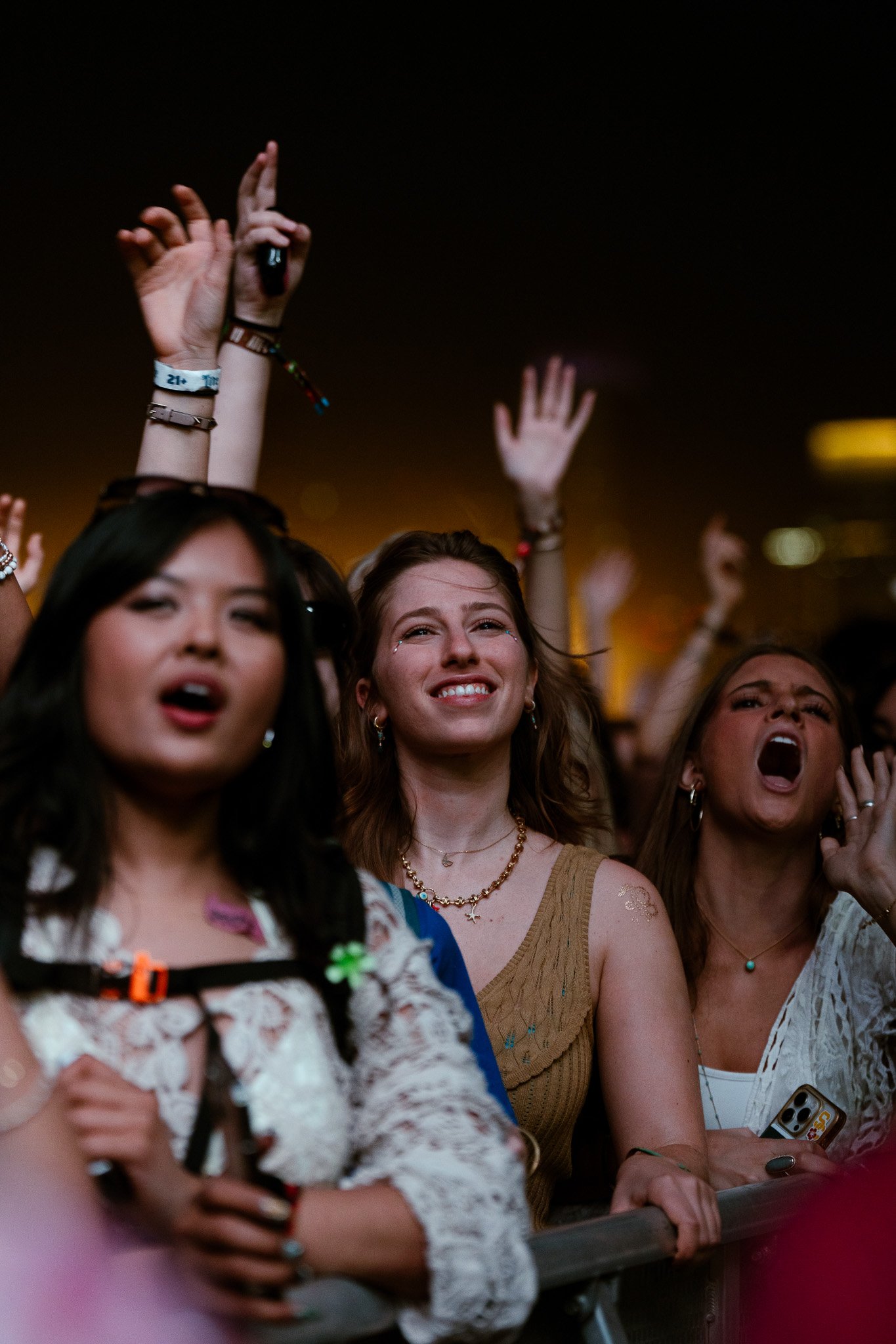  Fans on the barricade smile as The Chainsmokers take the stage. 