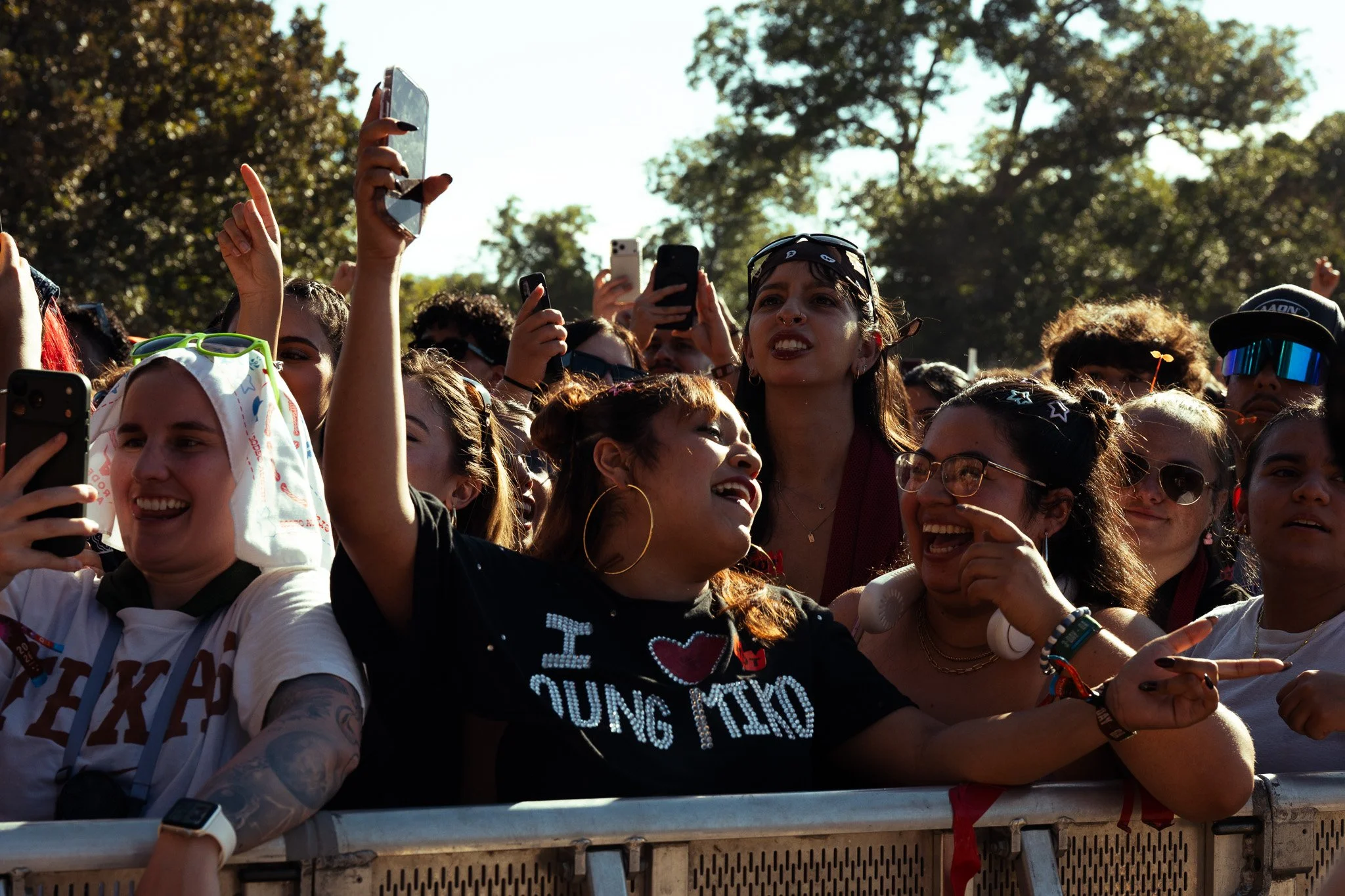  Fans of Young Miko cheer between songs. 