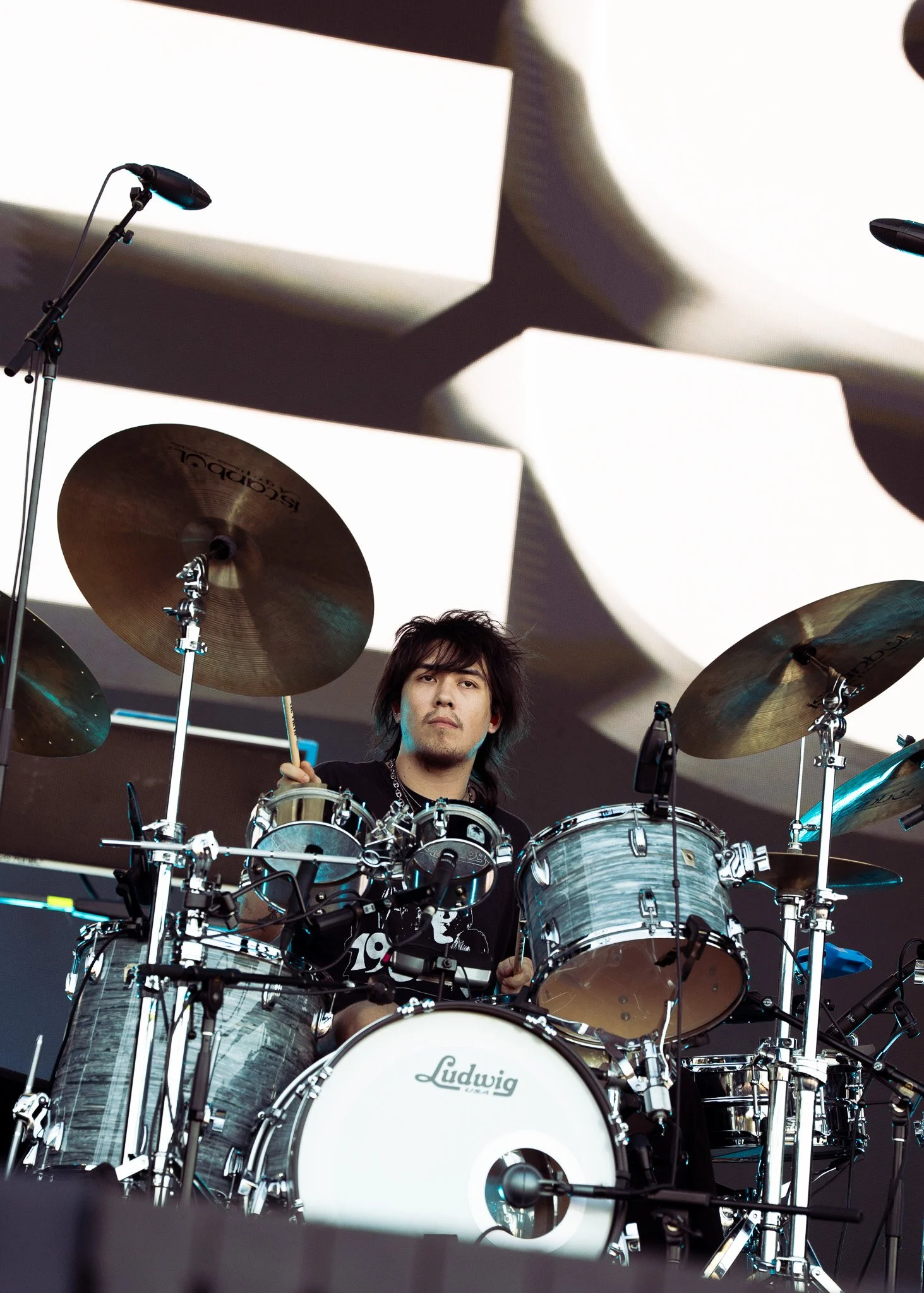  Drummer Max Bassin of American rock band Geese drums along to the beat of “Islands of Men” from the band’s 2025 album  Getting Killed . 