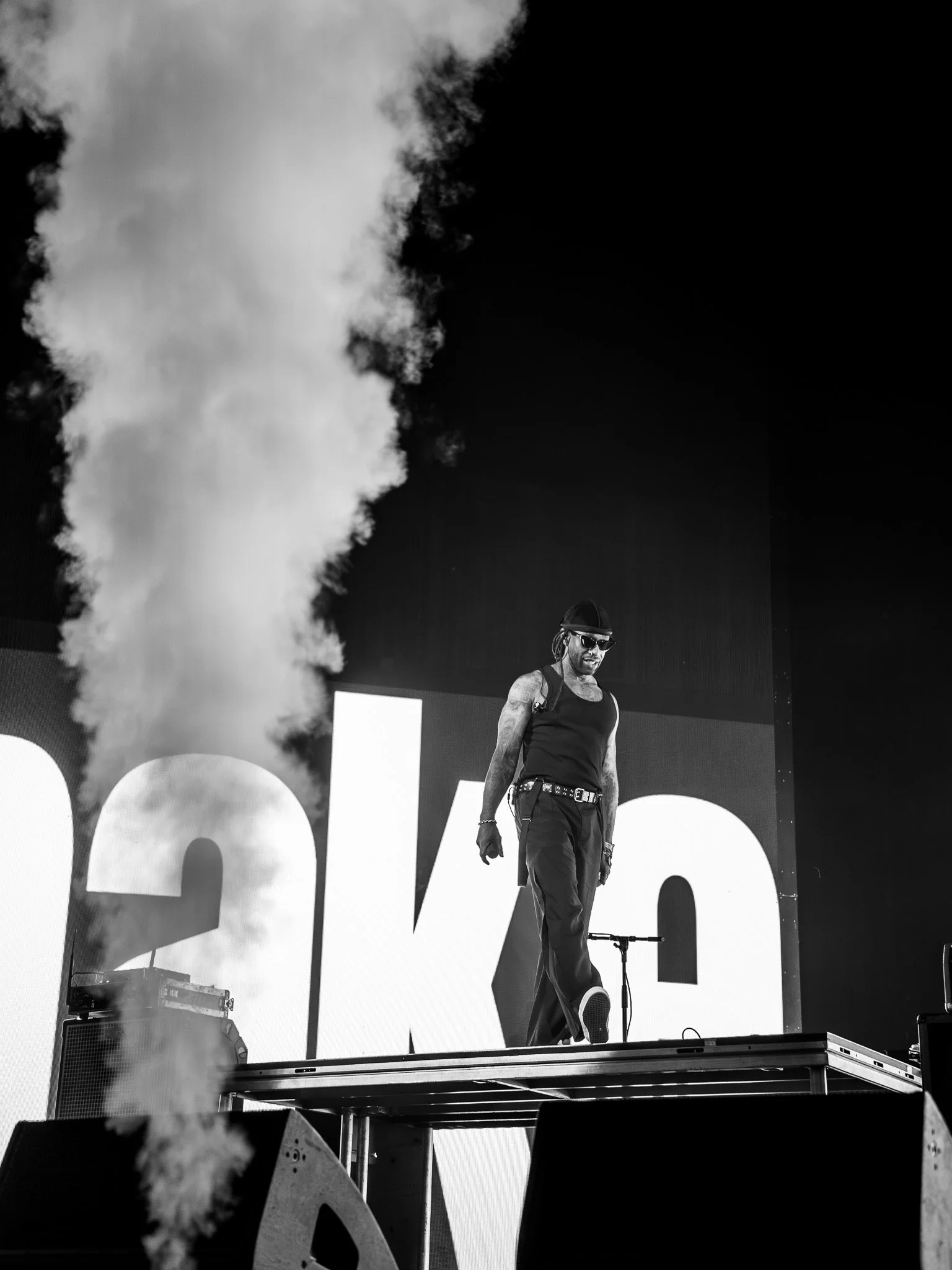  R&amp;B singer   Ty Dolla $ign walks across a raised platform as smoke shoots up beside him during his performance of “Paranoid” from his 2014 EP  Beach House.  