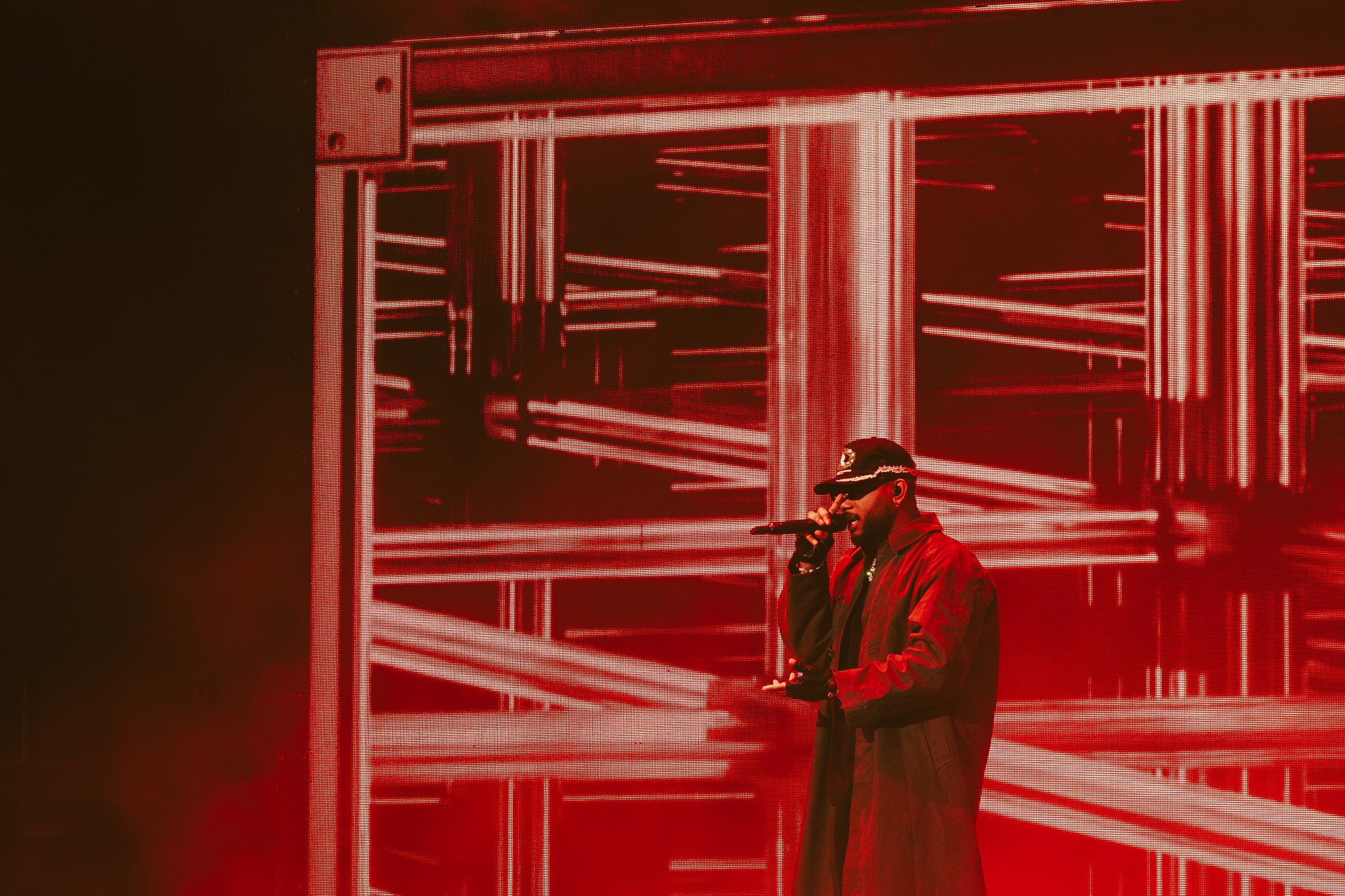  Tiller sings into the microphone during “For However Long” from his 2015 album  TRAPSOUL.  