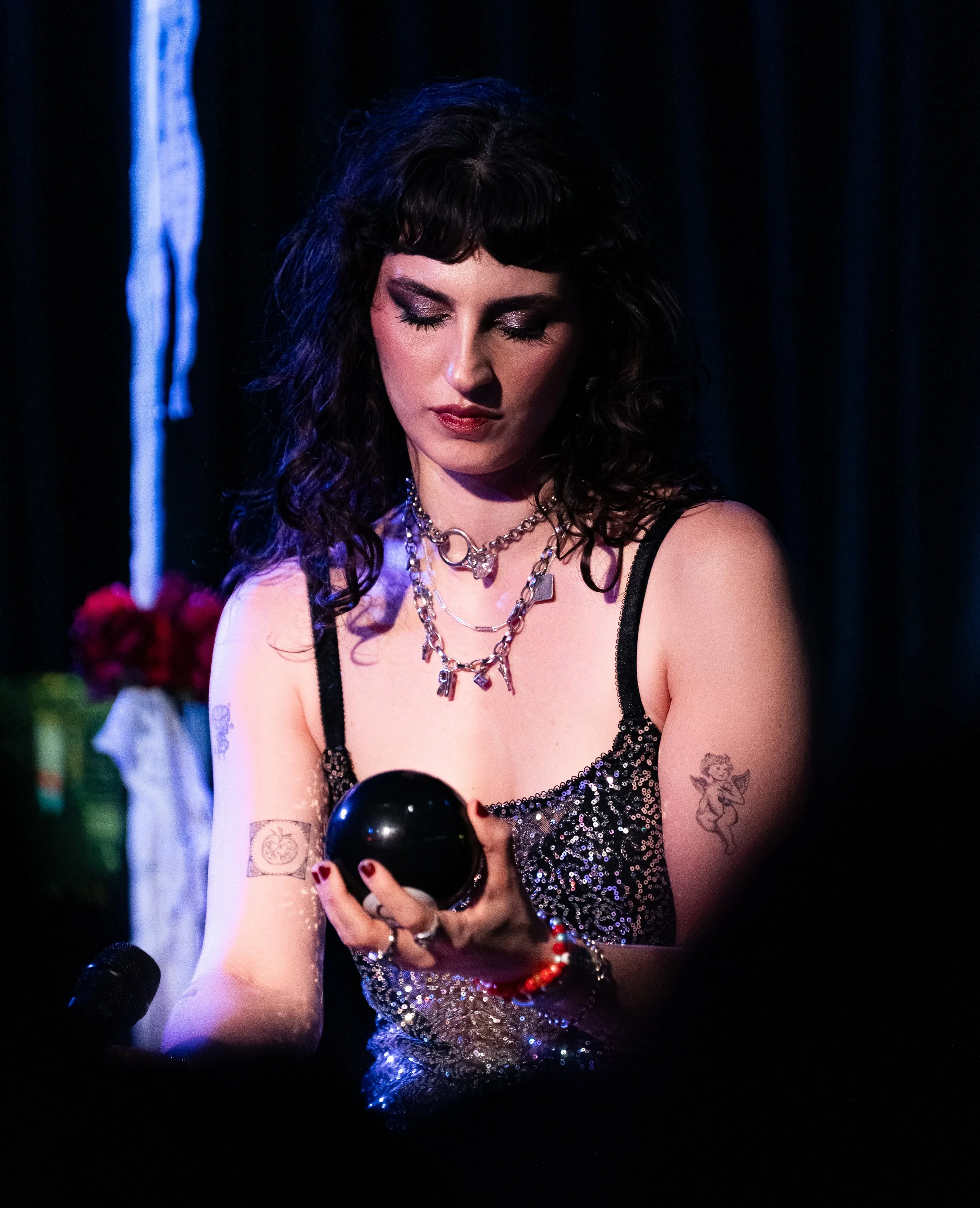  Bochner stares down at her Magic 8 Ball before starting the emotional ballad “Furniture.” 