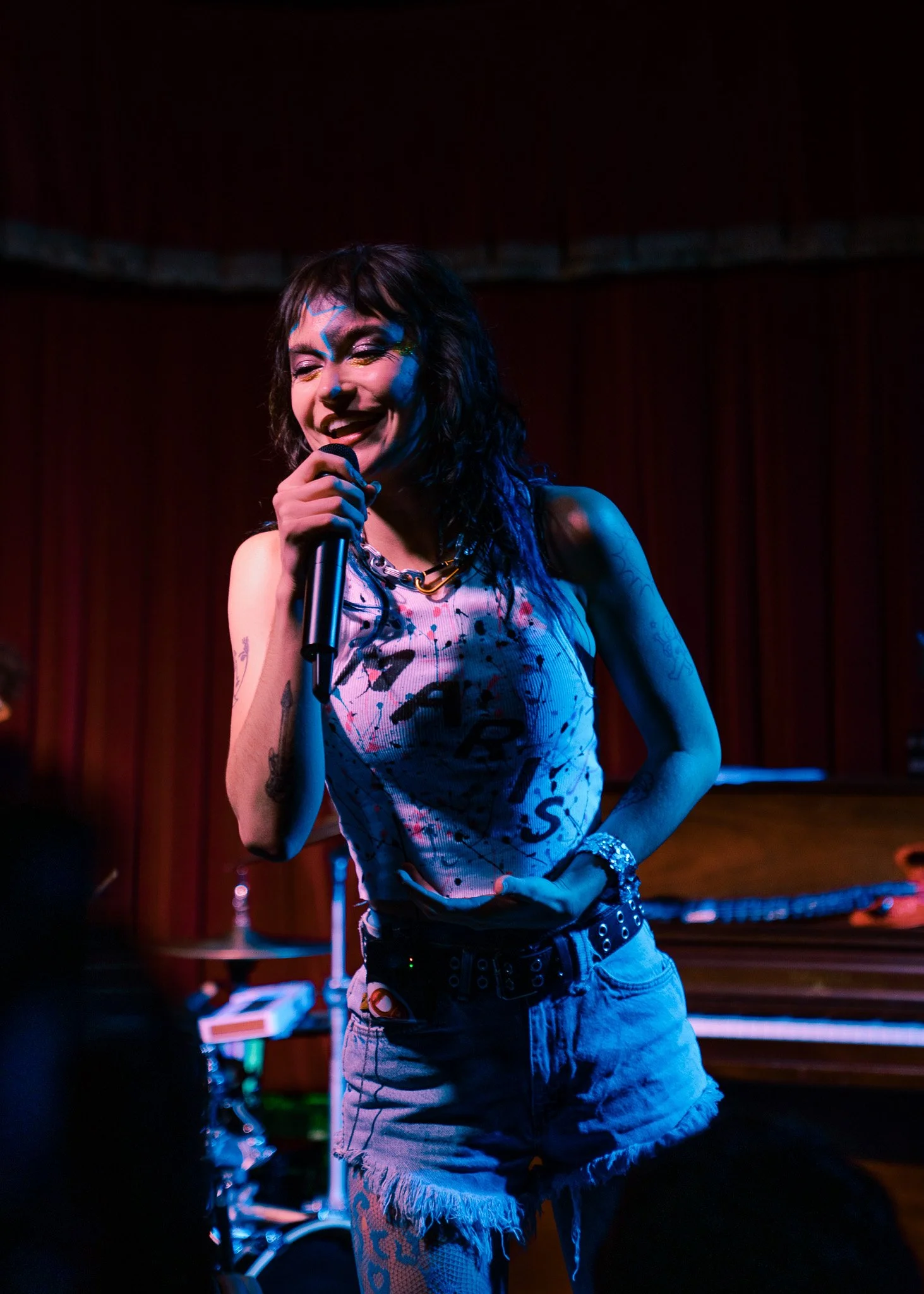  MARIS smiles into the crowd before beginning “Body Is On Fire,” the lead single from her 2026 EP  MOSH★PIT . 