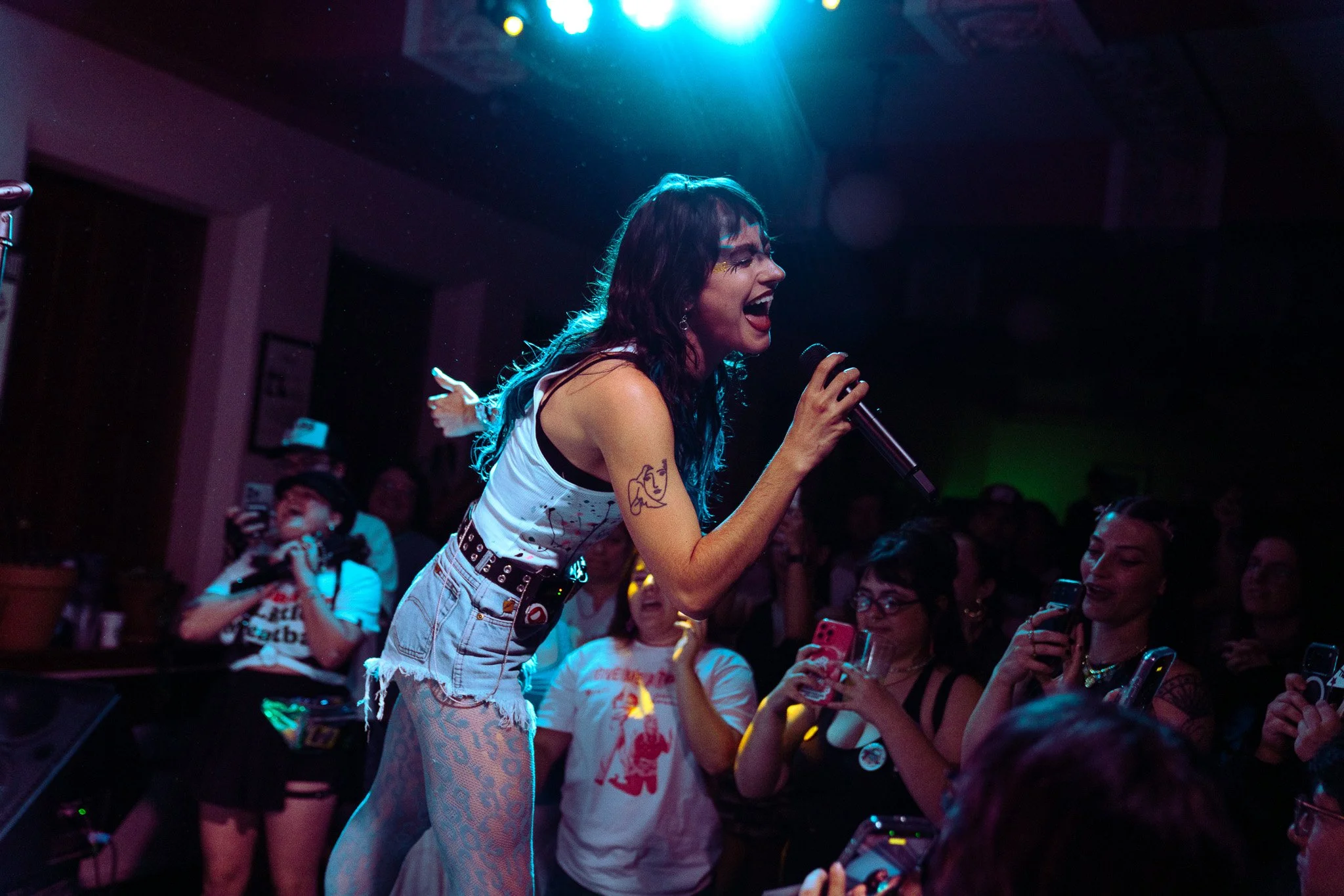  MARIS happily performs “Body Is On Fire” as fans scream the lyrics back at her: “I might crash out / One second you pull me into you, then you push me out / Caught feelings faded, but baby I'm stone cold sober now.” 