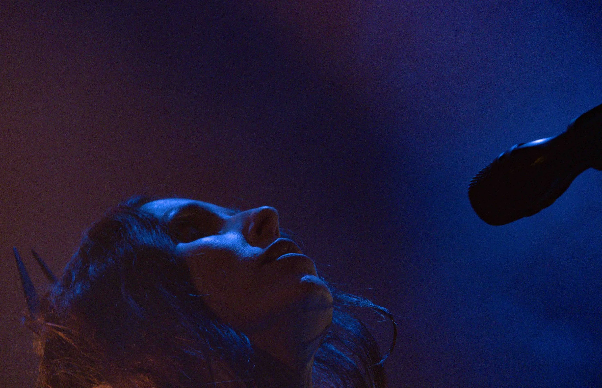  Wolfe performs her crushing song “Iron Moon” with an electric guitar.&nbsp; 
