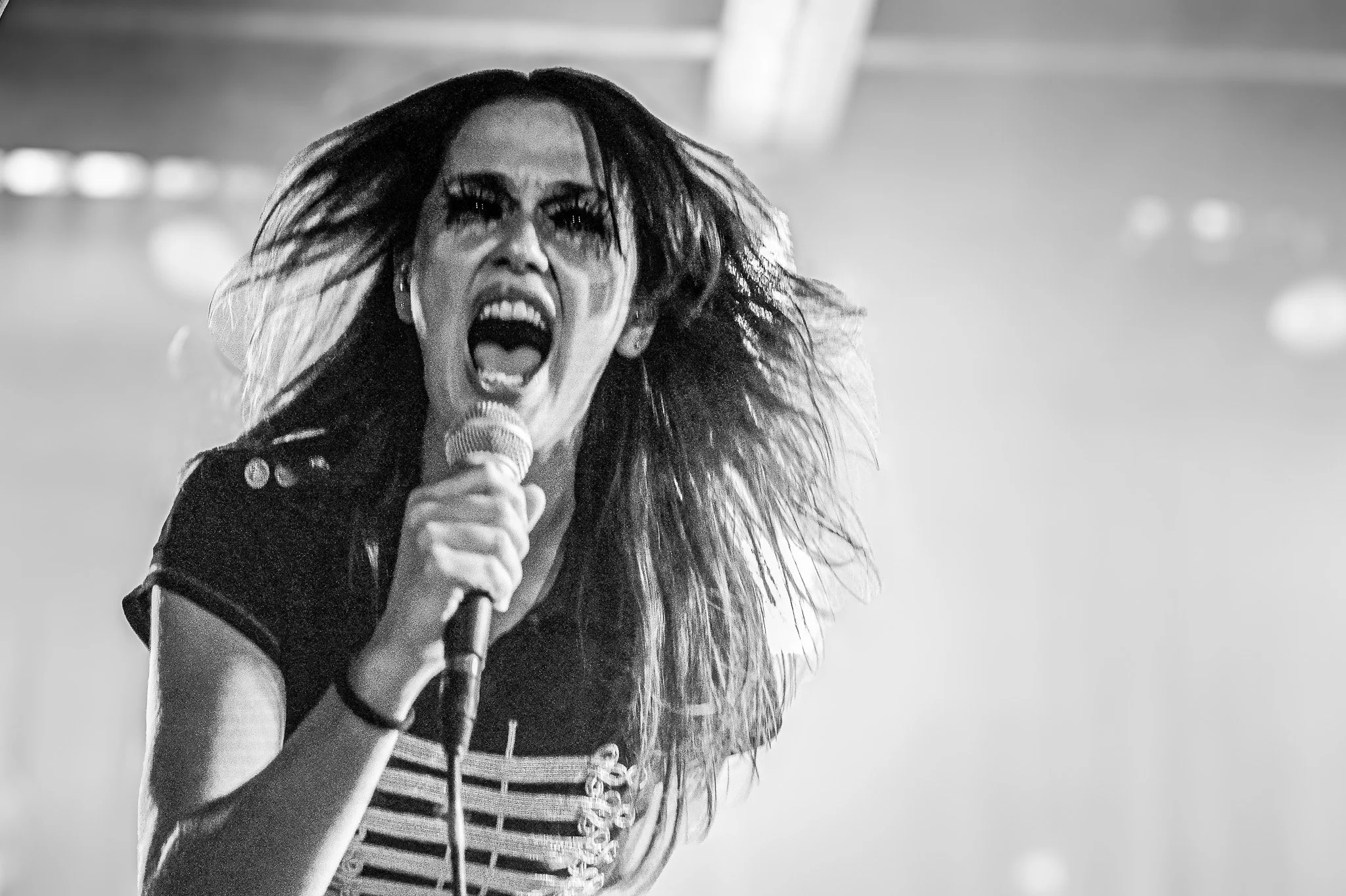  With a mosh pit forming, Lemons sings “ice the bruise.” 
