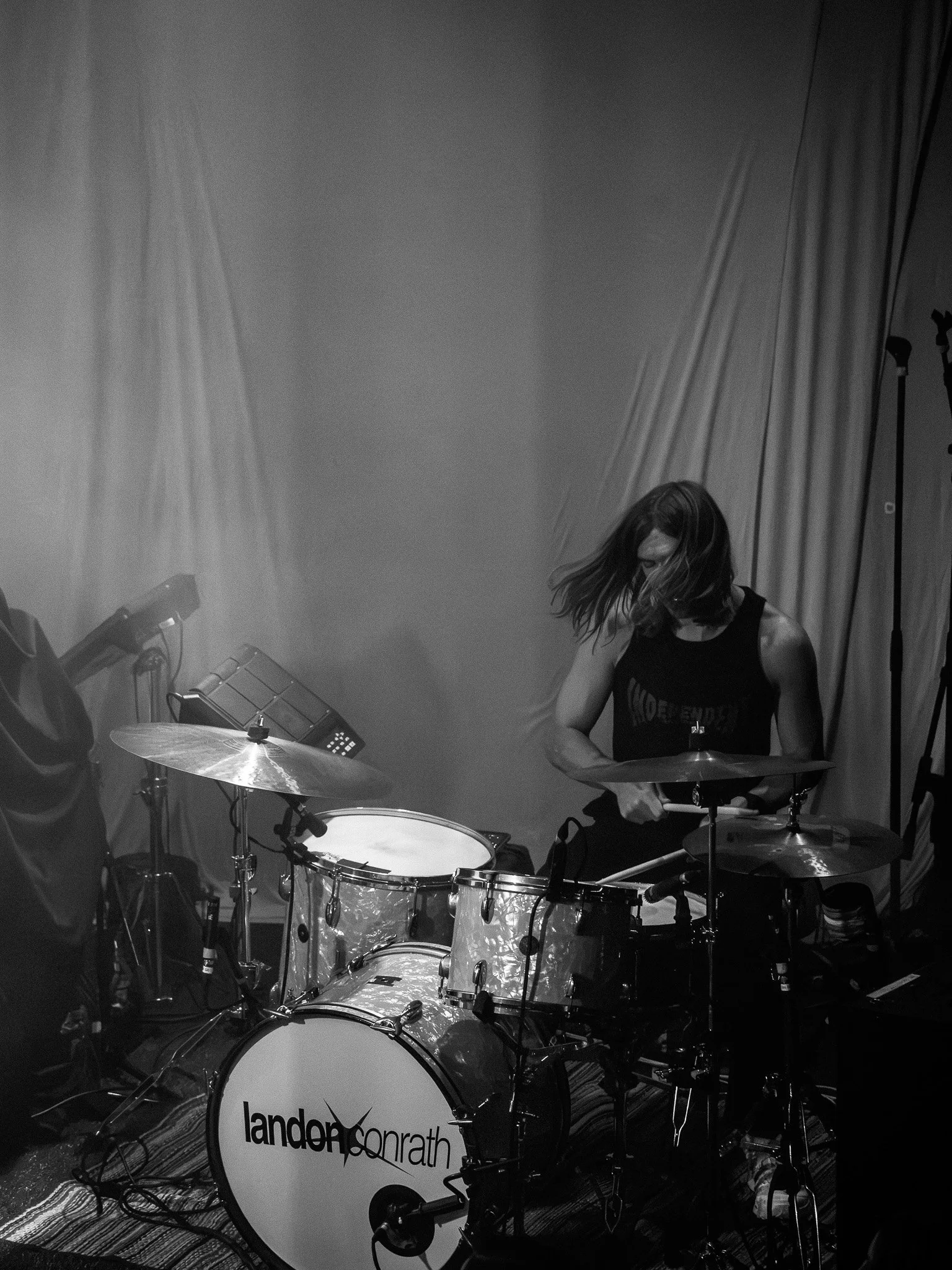  Drummer Michael Sawczak’s hair swings as he plays “Static” from Conrath's 2021 EP  Dazed &amp; Confused.  