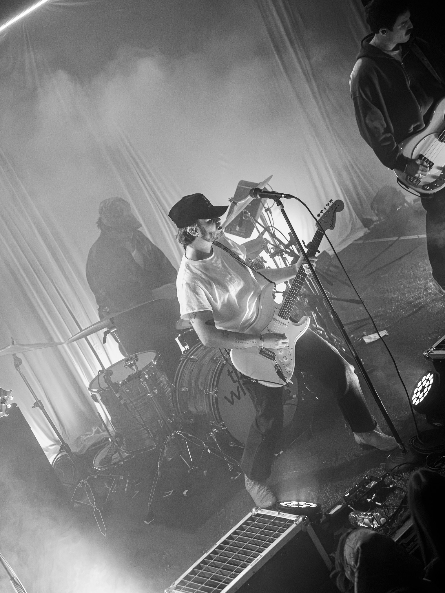  Lead vocalist of The Wldlfe, Jansen Hogan, strums his guitar during the opening performance of“Ruby” from its latest album  Revolver.  