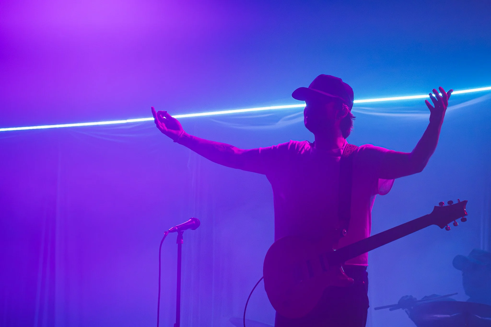  Hogan stretches out his arms during the performance of&nbsp; “Wreck My Life” from the band’s 2024 album  Heaven is a place.  