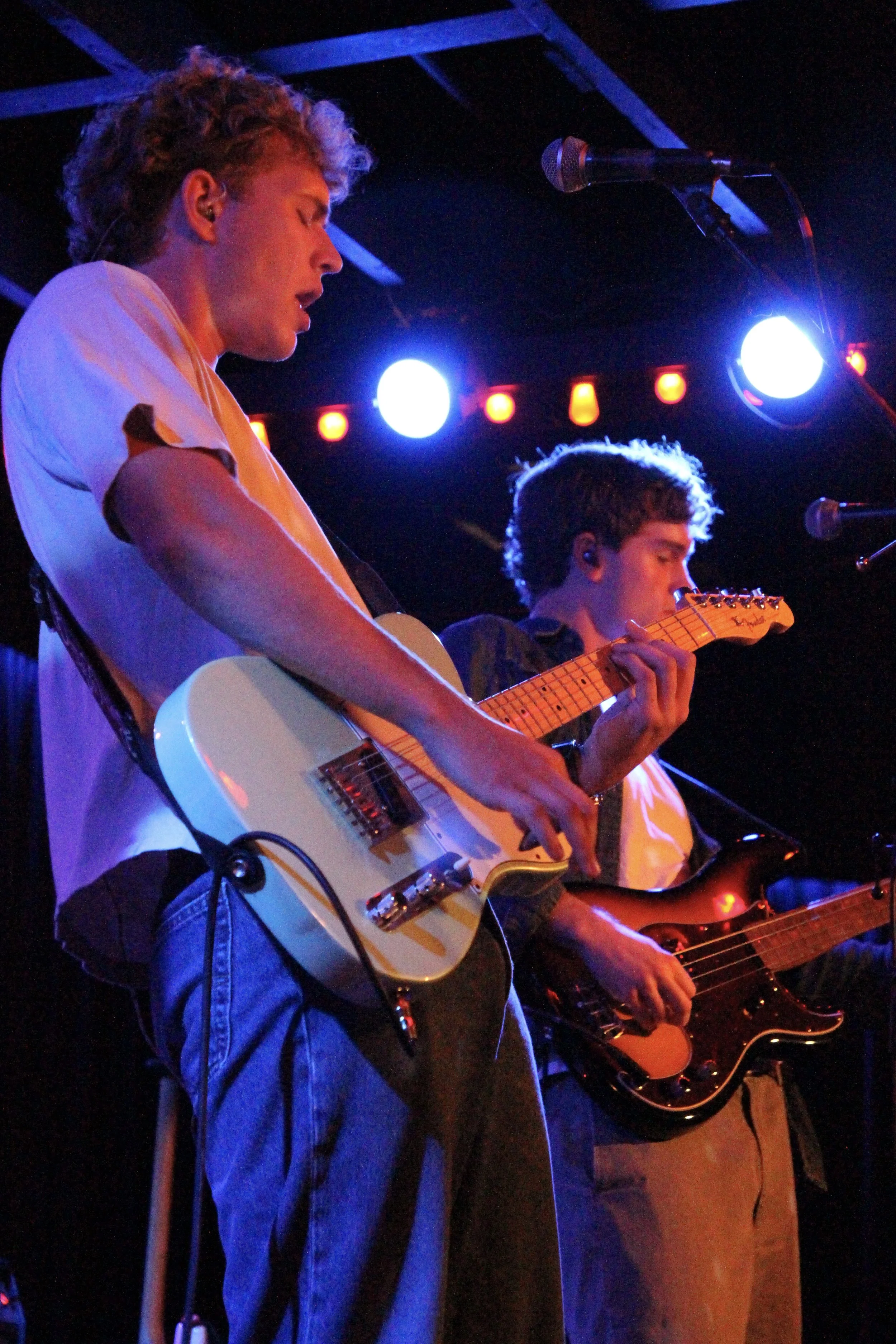  The Band Solstice trades guitar riffs beneath a wash of blue and red lights while covering Radiohead’s track “Weird Fishes/Arpeggi.” 