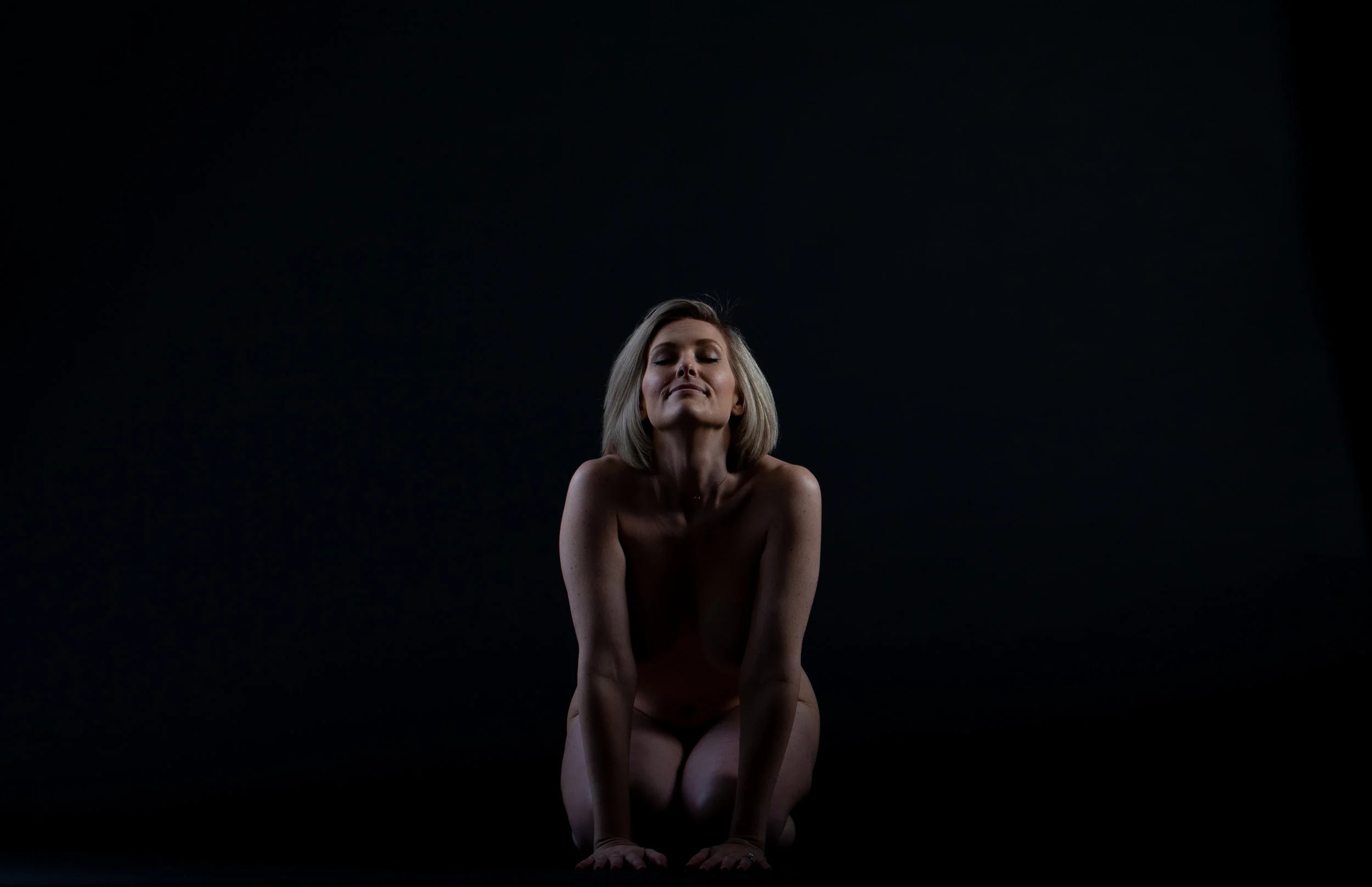 Heidi kneeling eye closed .jpg