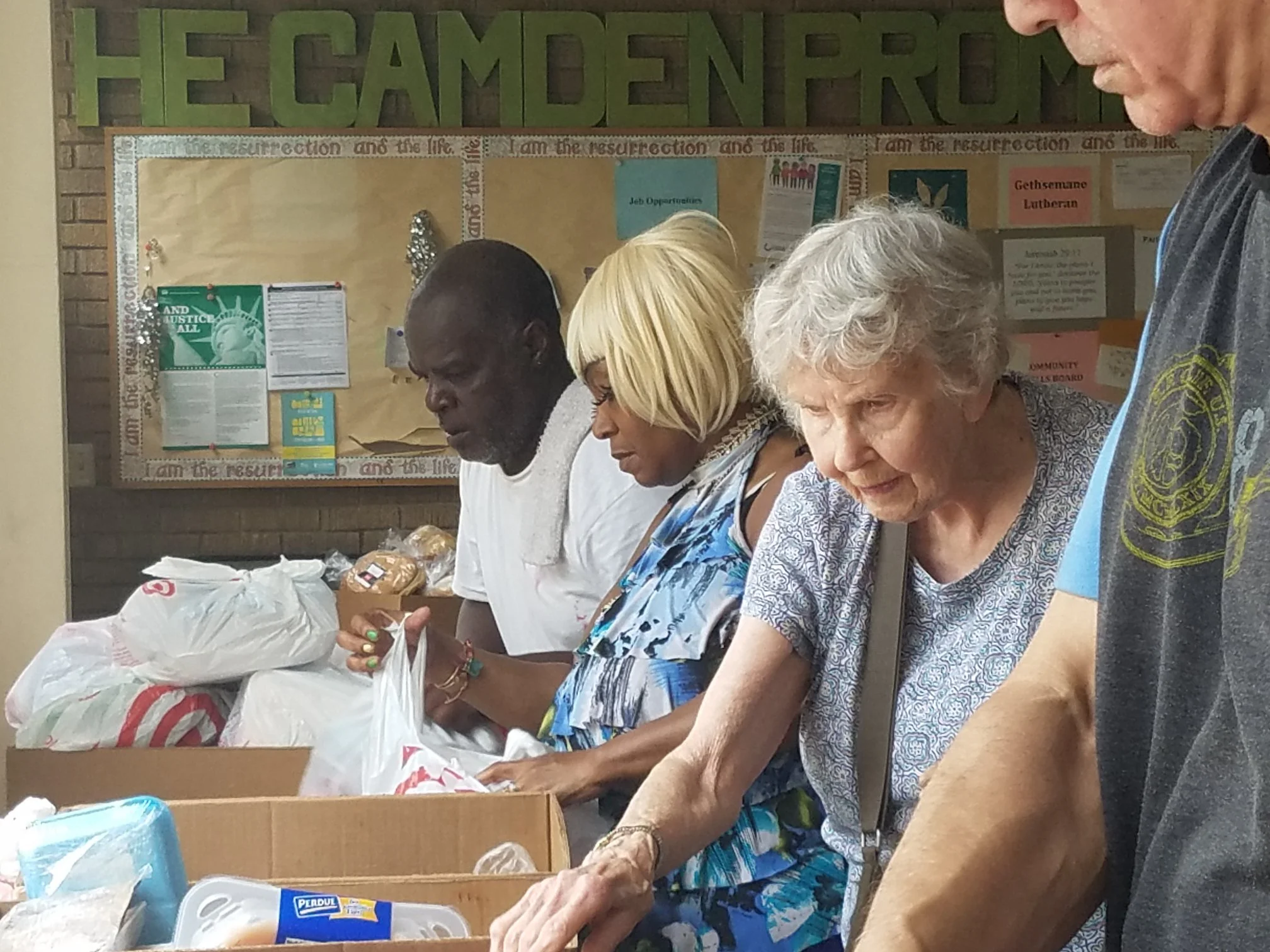 Our volunteers helped to mark, sort and organize the day's distrubution with about 15 other volunteers, to serve the 43 families who would be visiting that day.
