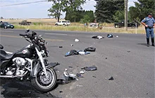 At the collision site, the Van Lears’ motorcycle and the Jeep in the background.