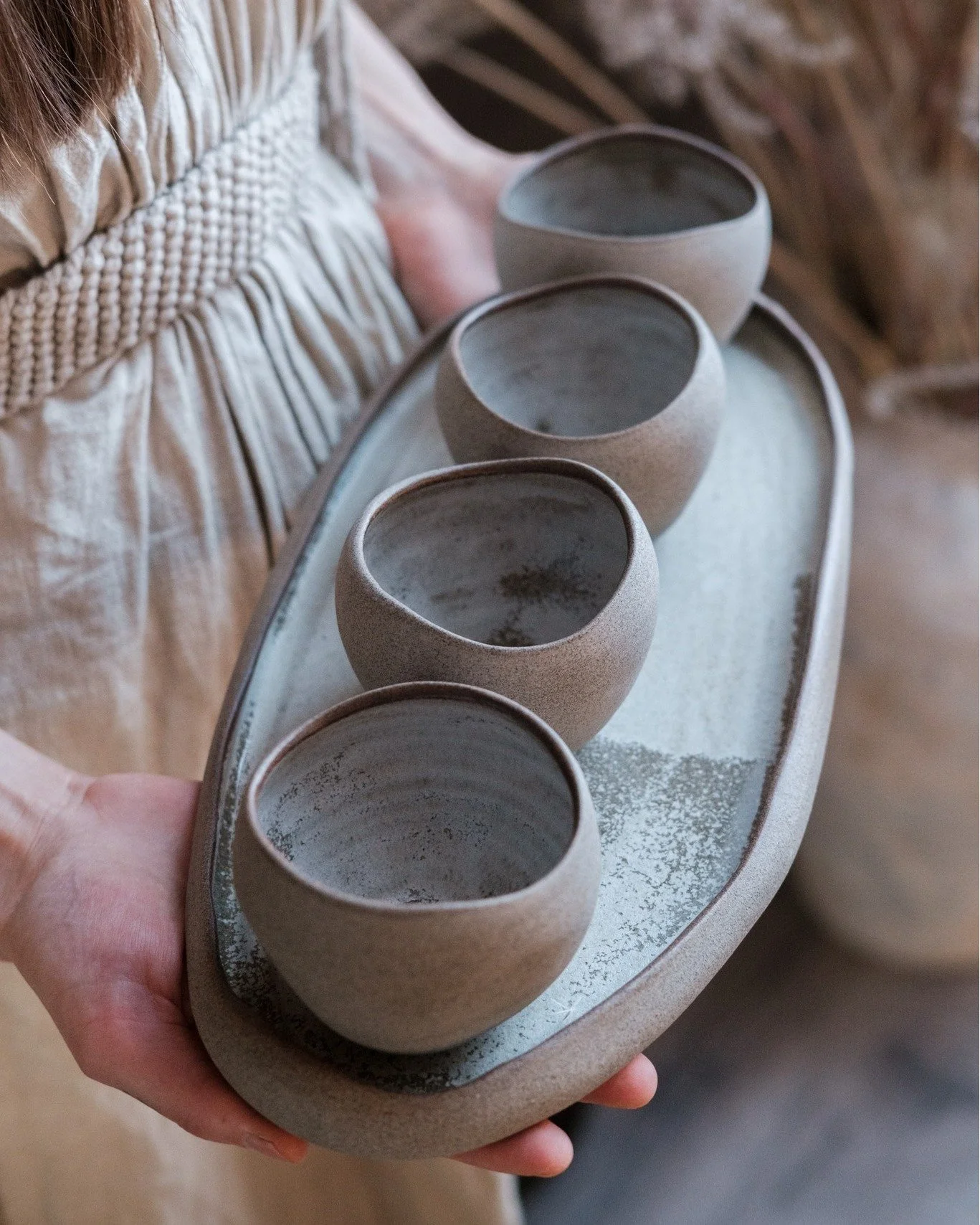 The STONE Collection remains the backbone of our studio practice.

Defined by a raw, unglazed exterior that undergoes three stages of hand-polishing, each surface reveals a stone-like tactility . The forms are shaped by undulating rims and quiet asym