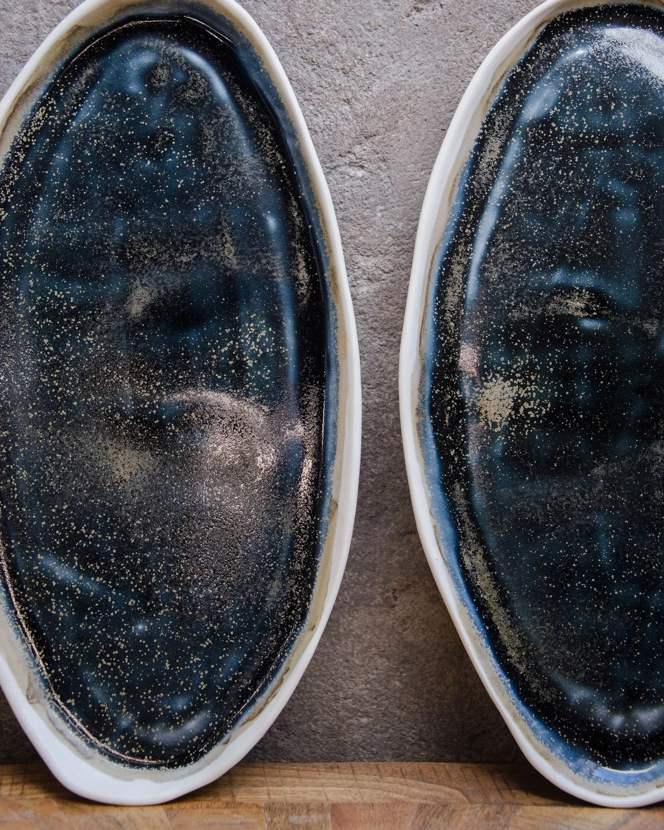 Latest tapas set in porcelain with the wonderful Galaxy glaze.

This special-effect glaze evokes the depth of a night sky. Where the glaze gathers thicker, it pools into deep blue-green tones, while delicate golden crystal flecks appear like distant 