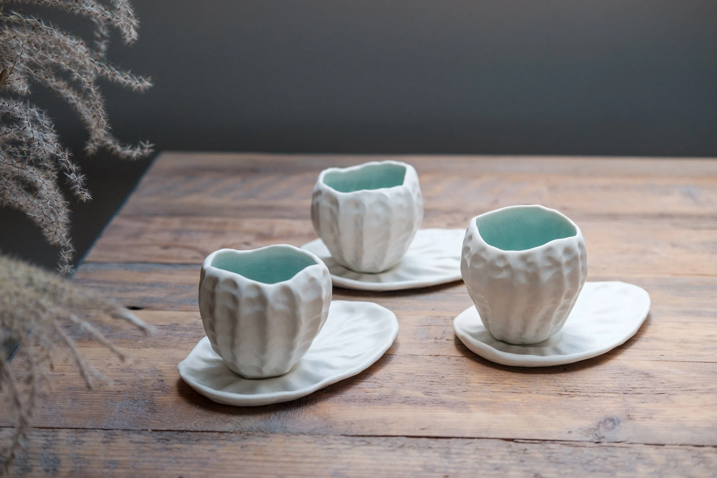 hand-built cups and saucers